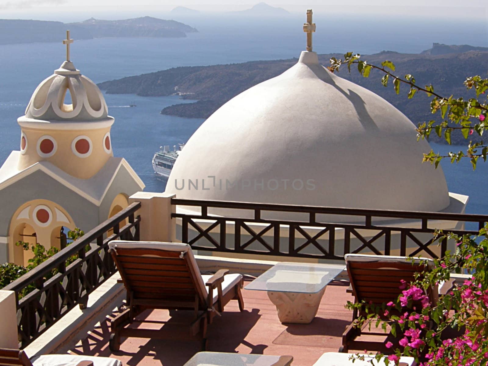 two church domes overlooking the sea on Santorini's island in Greece