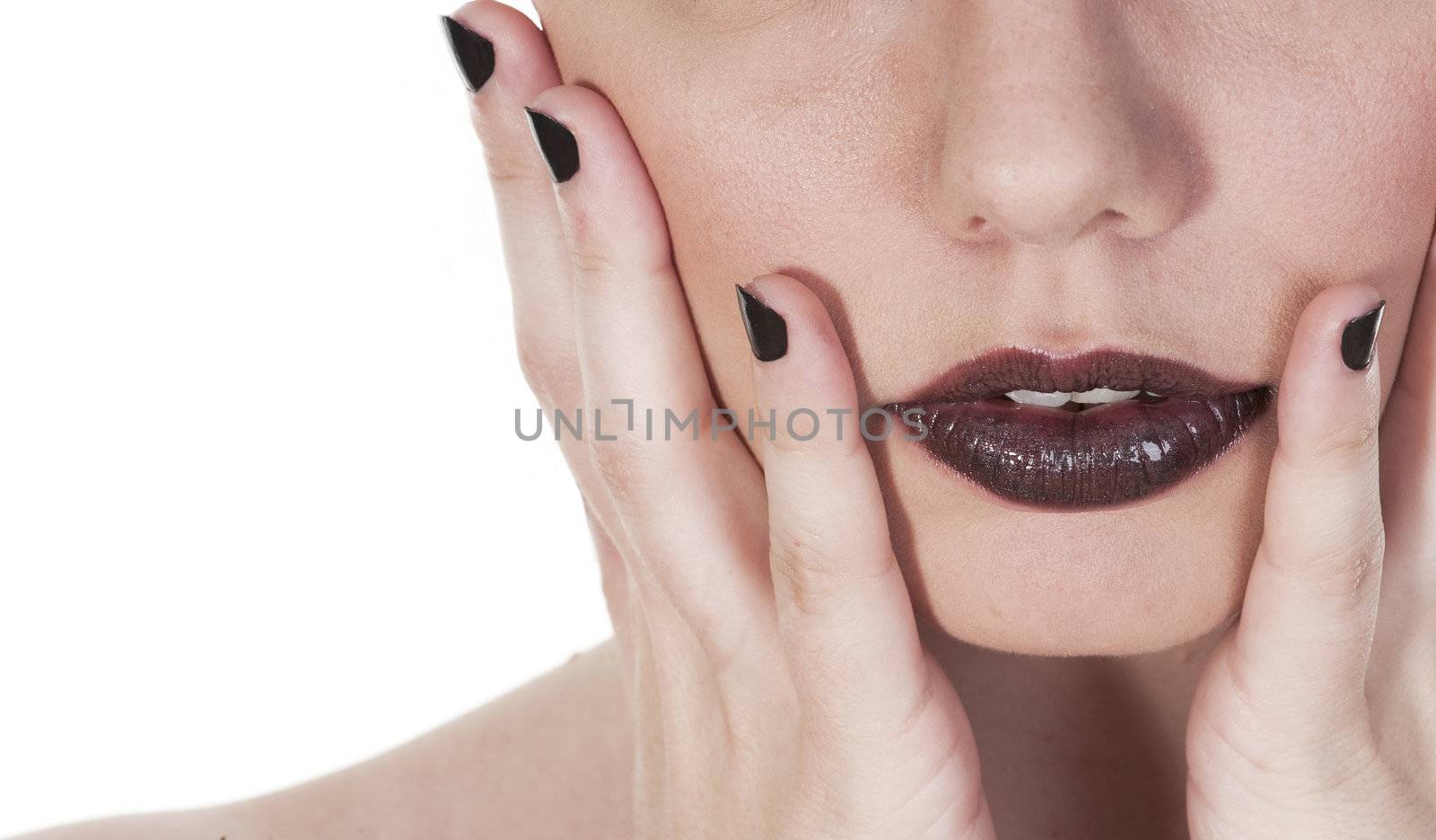 Beautiful girls mouth close up, seen against white background