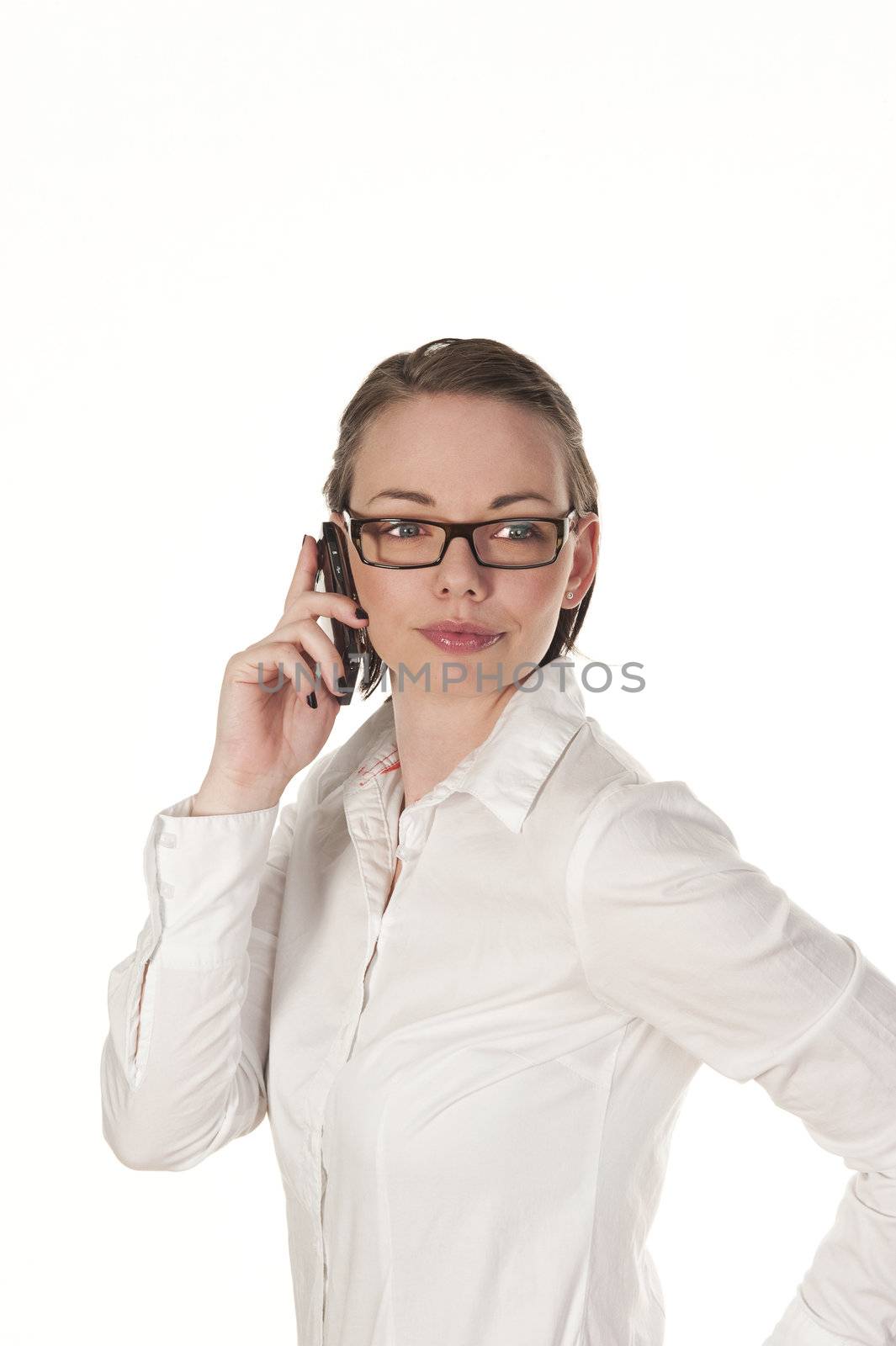 Beautiful girl speaking on the phone, seen isolated on white background