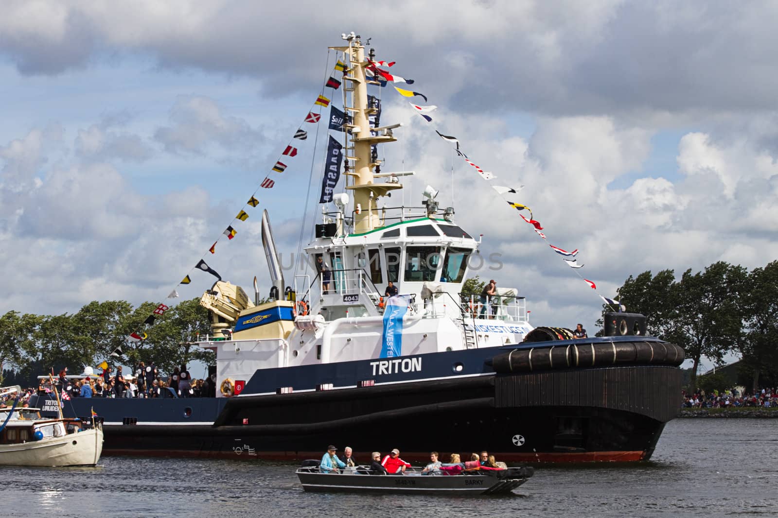 SAIL AMSTERDAM 2010 -IJMUIDEN, THE NETHERLANDS - AUGUST 2010: Sail 2010 starts with the spectaculair Sail-in Parade.  50 Tall ships and more than 500 of  naval ships, replicas and yachts sail in convoy through the North Sea Canal from IJmuiden to Amsterdam. Thousands of private boats accompany the fleet and more than 300.000 visitors watch the parade from the banks. August 19, 2010, IJmuiden, the Netherlands