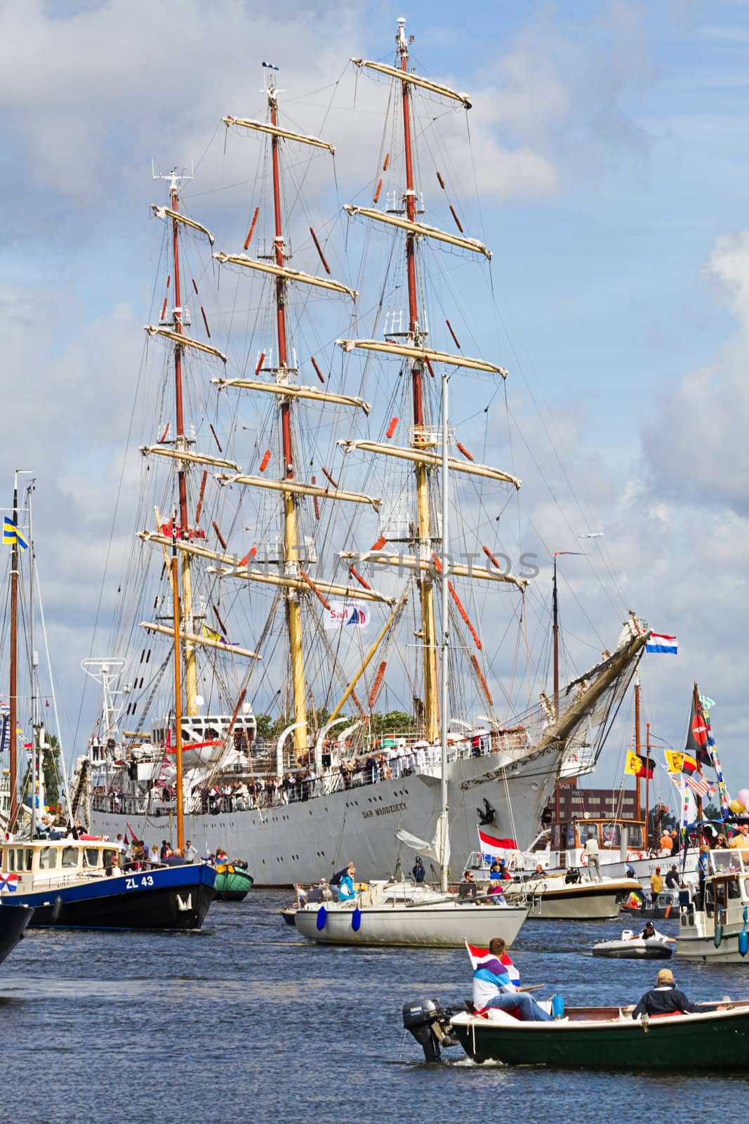 SAIL AMSTERDAM 2010 -IJMUIDEN, THE NETHERLANDS - AUGUST 2010: Sail 2010 starts with the spectaculair Sail-in Parade.  50 Tall ships and more than 500 of  naval ships, replicas and yachts sail in convoy through the North Sea Canal from IJmuiden to Amsterdam. Thousands of private boats accompany the fleet and more than 300.000 visitors watch the parade from the banks. August 19, 2010, IJmuiden, the Netherlands