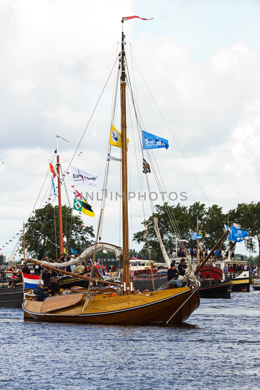 SAIL AMSTERDAM 2010 -IJMUIDEN, THE NETHERLANDS - AUGUST 2010: Sail 2010 starts with the spectaculair Sail-in Parade.  50 Tall ships and more than 500 of  naval ships, replicas and yachts sail in convoy through the North Sea Canal from IJmuiden to Amsterdam. Thousands of private boats accompany the fleet and more than 300.000 visitors watch the parade from the banks. August 19, 2010, IJmuiden, the Netherlands