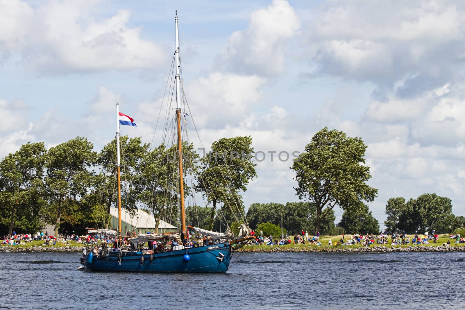 SAIL AMSTERDAM 2010 -IJMUIDEN, THE NETHERLANDS - AUGUST 2010: Sail 2010 starts with the spectaculair Sail-in Parade.  50 Tall ships and more than 500 of  naval ships, replicas and yachts sail in convoy through the North Sea Canal from IJmuiden to Amsterdam. Thousands of private boats accompany the fleet and more than 300.000 visitors watch the parade from the banks. August 19, 2010, IJmuiden, the Netherlands