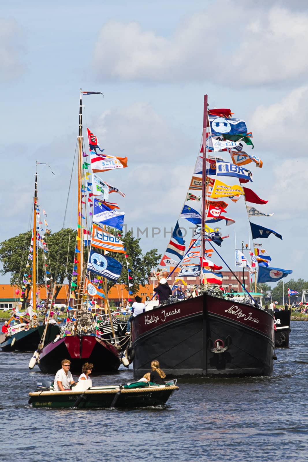 SAIL AMSTERDAM 2010 -IJMUIDEN, THE NETHERLANDS - AUGUST 2010: Sail 2010 starts with the spectaculair Sail-in Parade.  50 Tall ships and more than 500 of  naval ships, replicas and yachts sail in convoy through the North Sea Canal from IJmuiden to Amsterdam. Thousands of private boats accompany the fleet and more than 300.000 visitors watch the parade from the banks. August 19, 2010, IJmuiden, the Netherlands