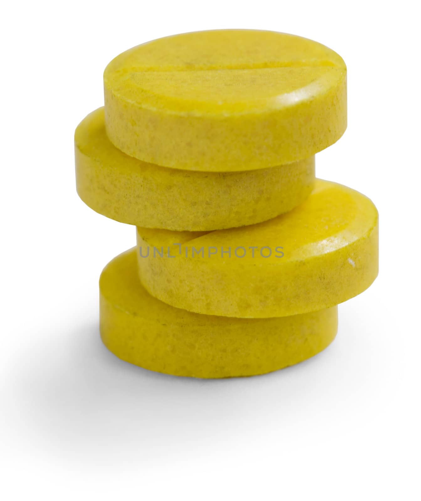 Pile from four yellow tablet on the white background
