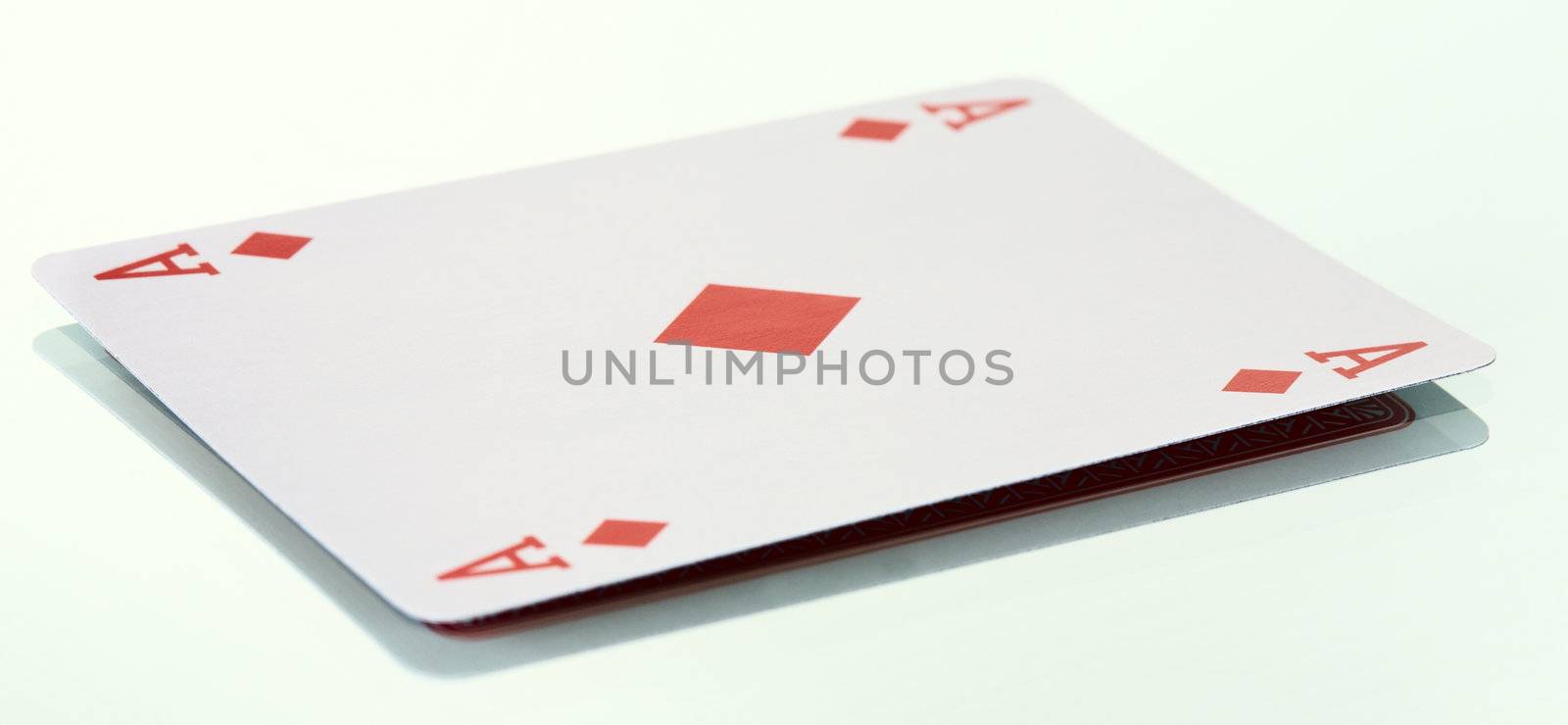 The ace of diamonds on the smooth surface background