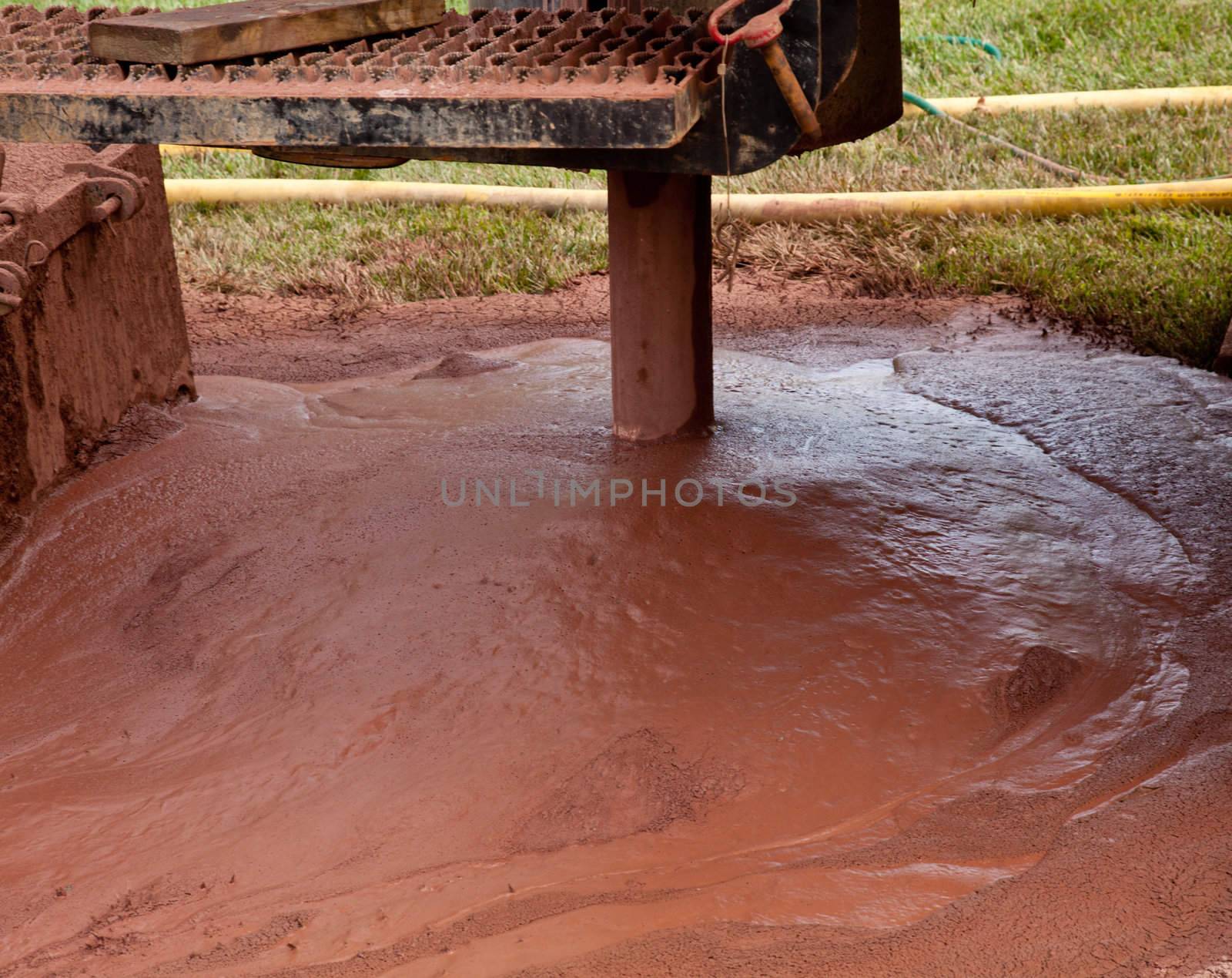 Slurry of mud from drilling for geothermal power system in suburban yard