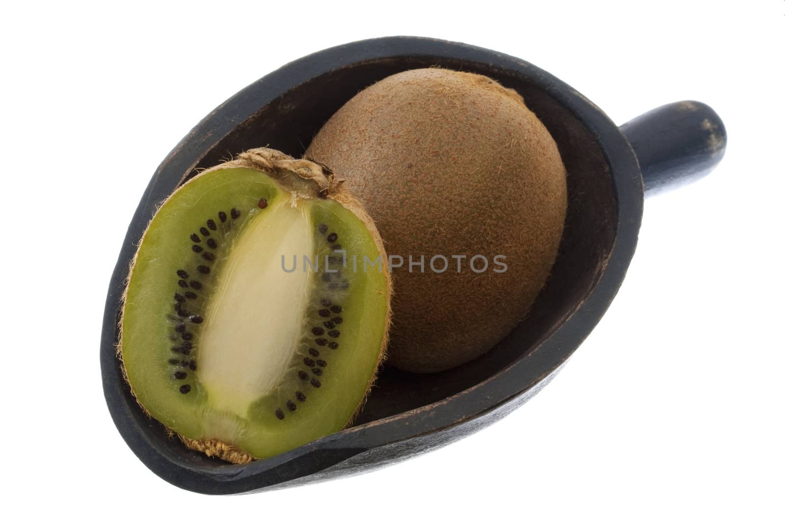 whole and cross section of kiwi fruit on a rustic, wooden scoop, isolated on white