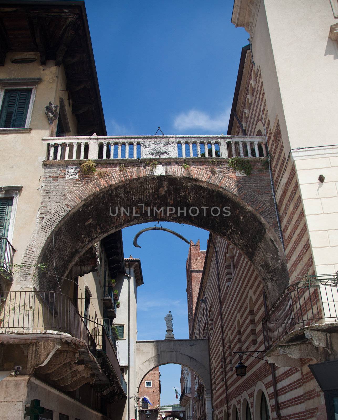 Arches between Erbe and Signori in Verona with hanging whale bone