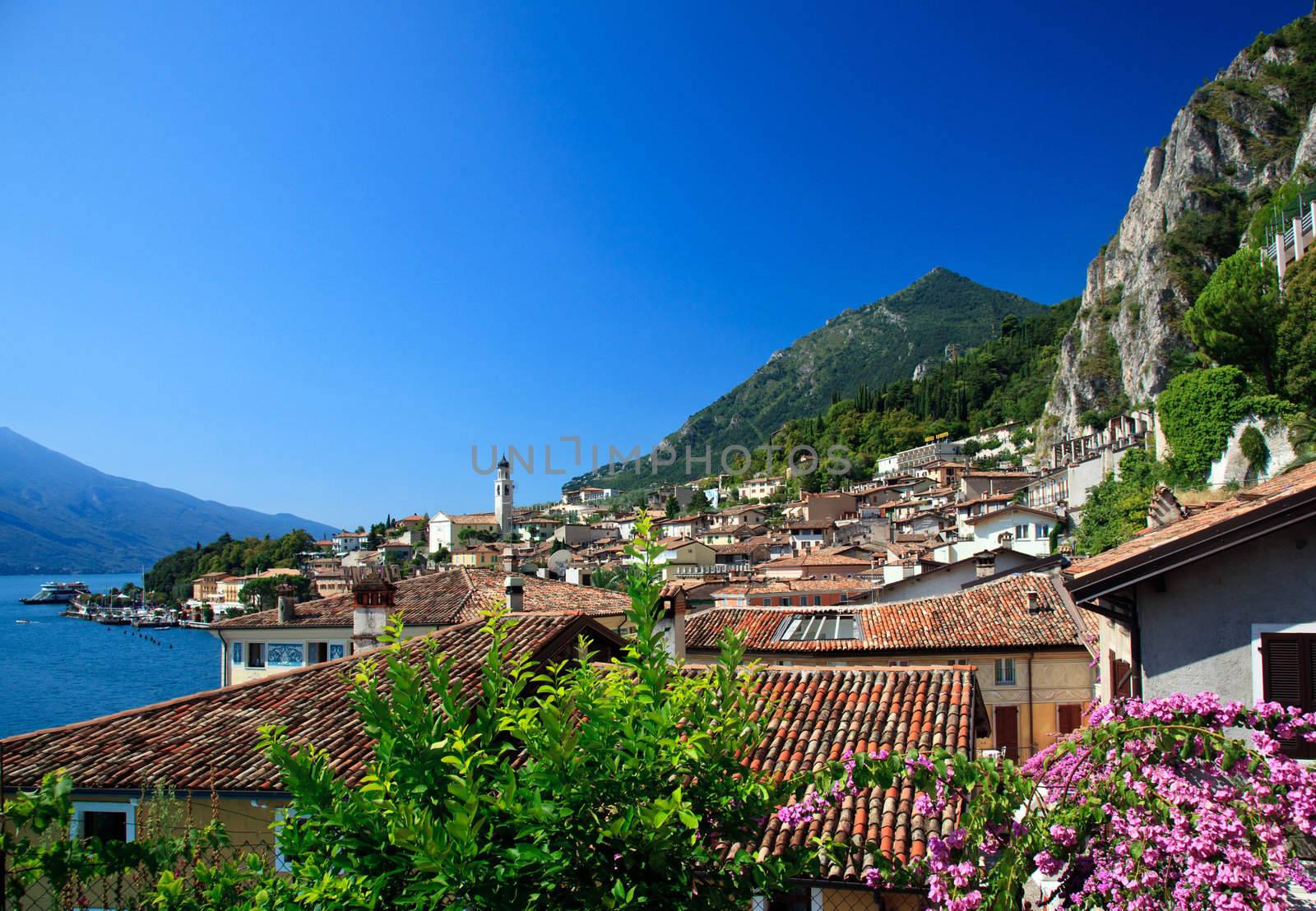 Flowers frame the rooftops of Limone on Lake Garda Italy