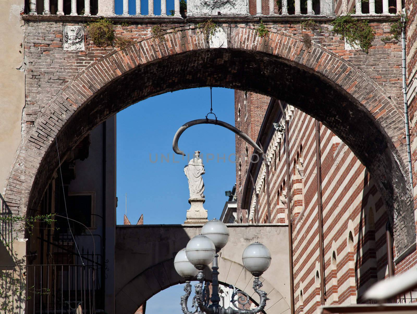 Arches between Erbe and Signori in Verona with hanging whale bone
