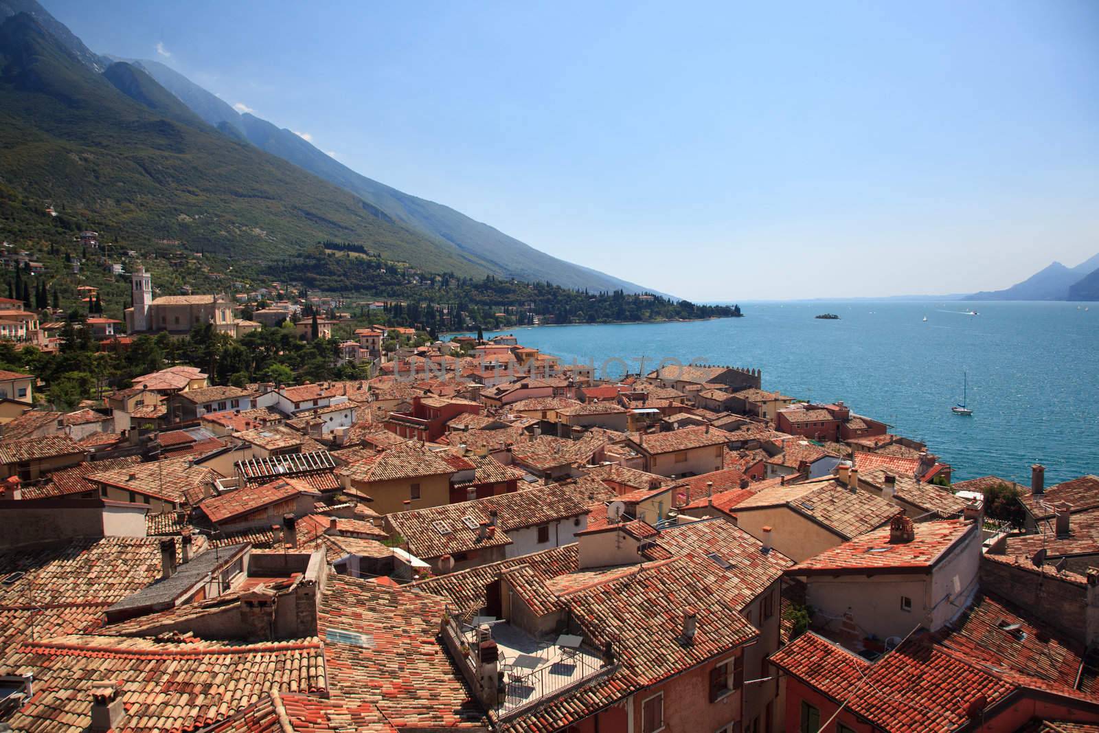 View over Lake Garda over the tiled roofs of Malcesine