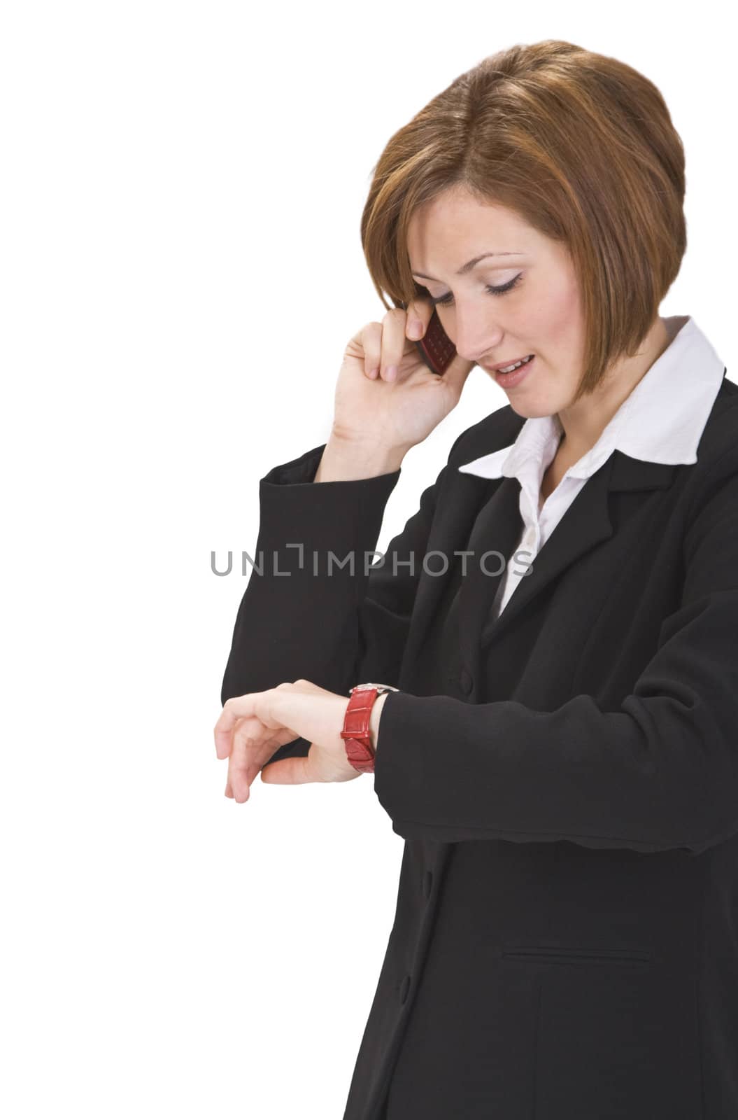 Busy businesswoman checking the time while calling.