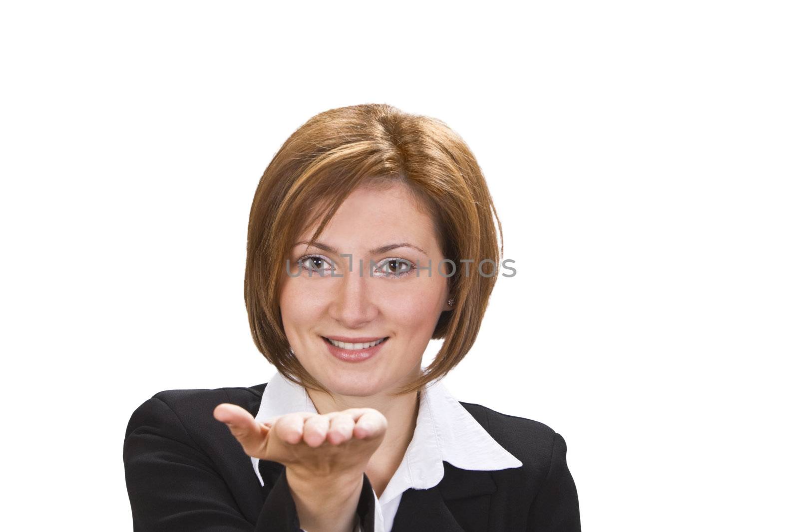 Smiling brunette offering something on her hand.Selective focus on the face.
