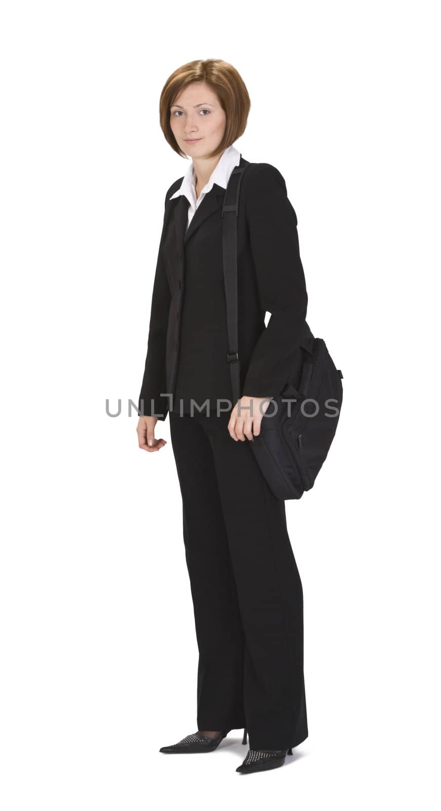 Young businesswoman with computer bag over her shoulder standing up.