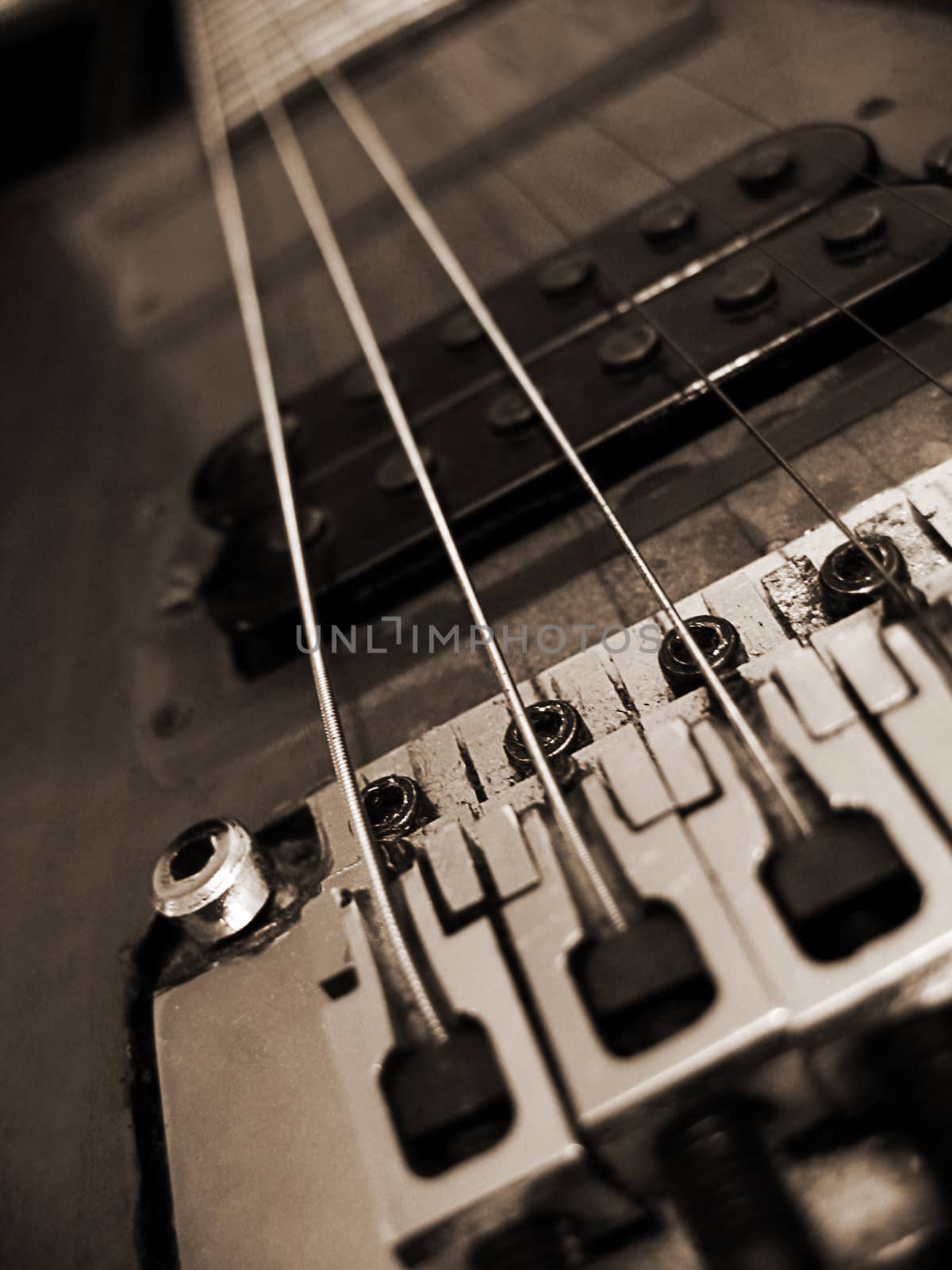Detail of vintage electric acoustic guitar, sepia colored
