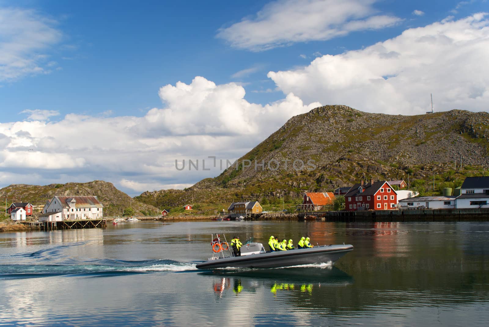 Motor boat is in a fjord of Norway