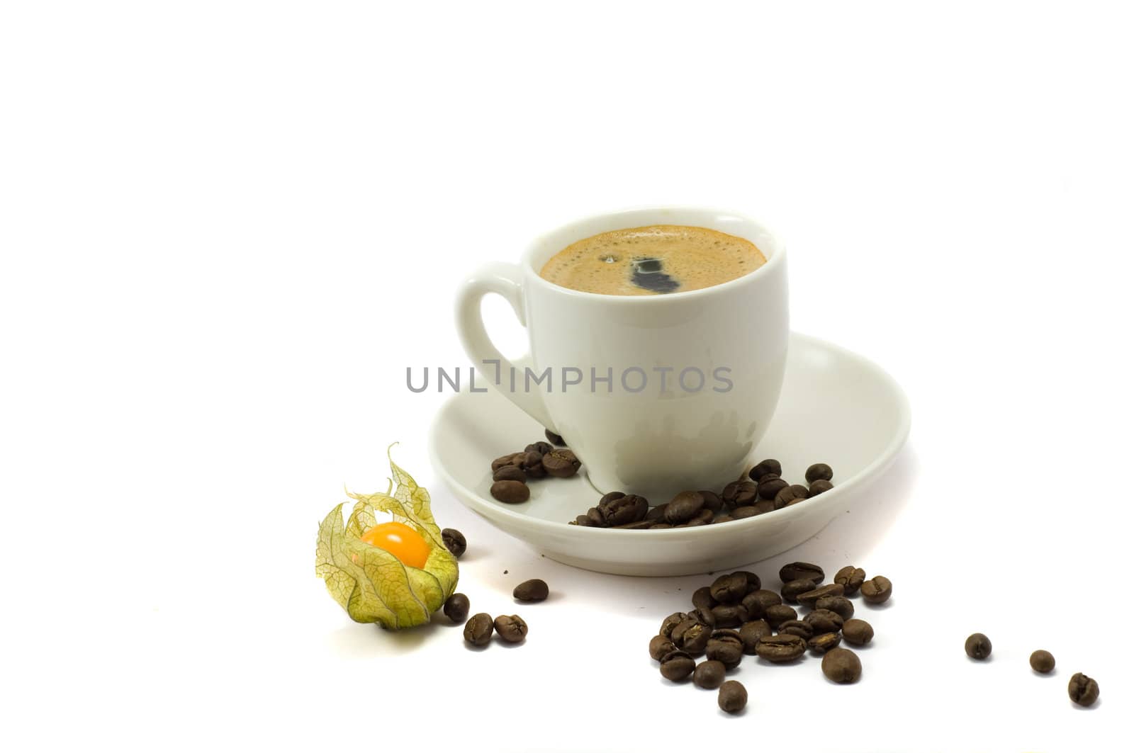 Cup of coffe and physalis on the white