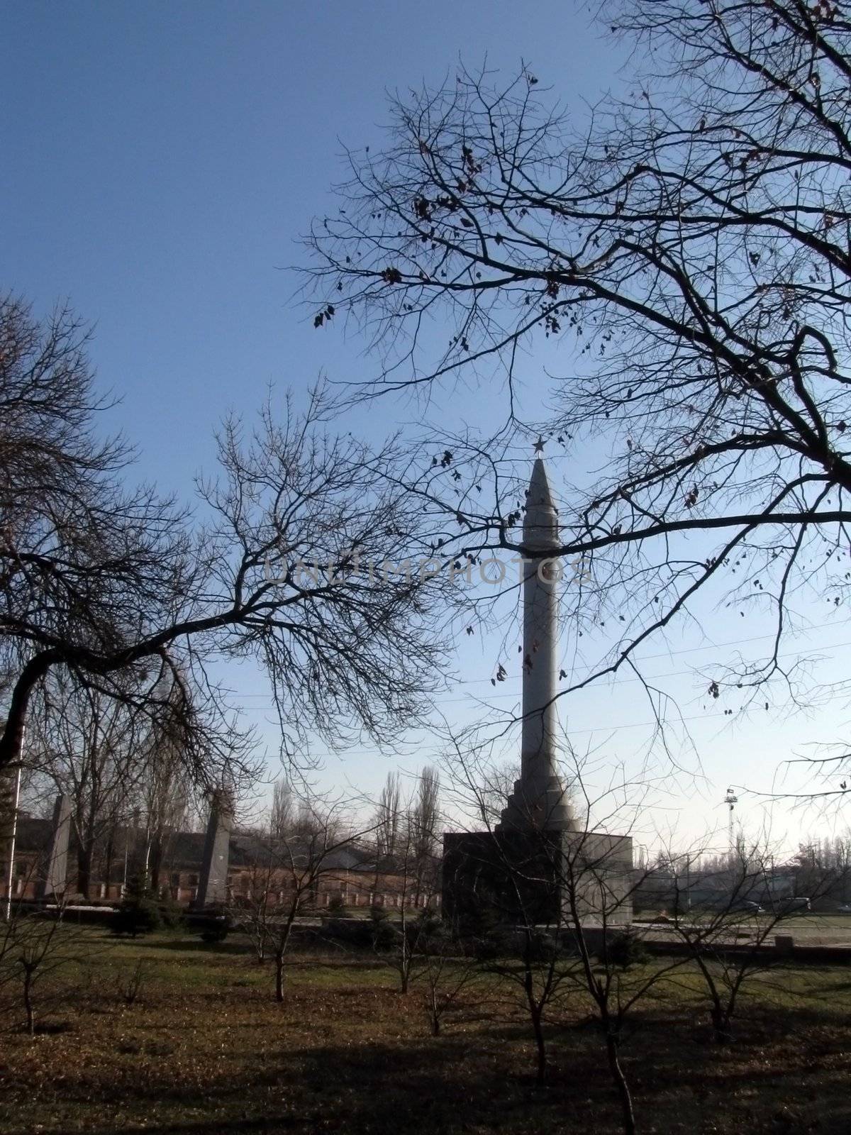 Monument, eternal flame, laid, architectral building, styles, park, garden, place for rest and walks, tree, star, place of the worship, memory, blue sky, city