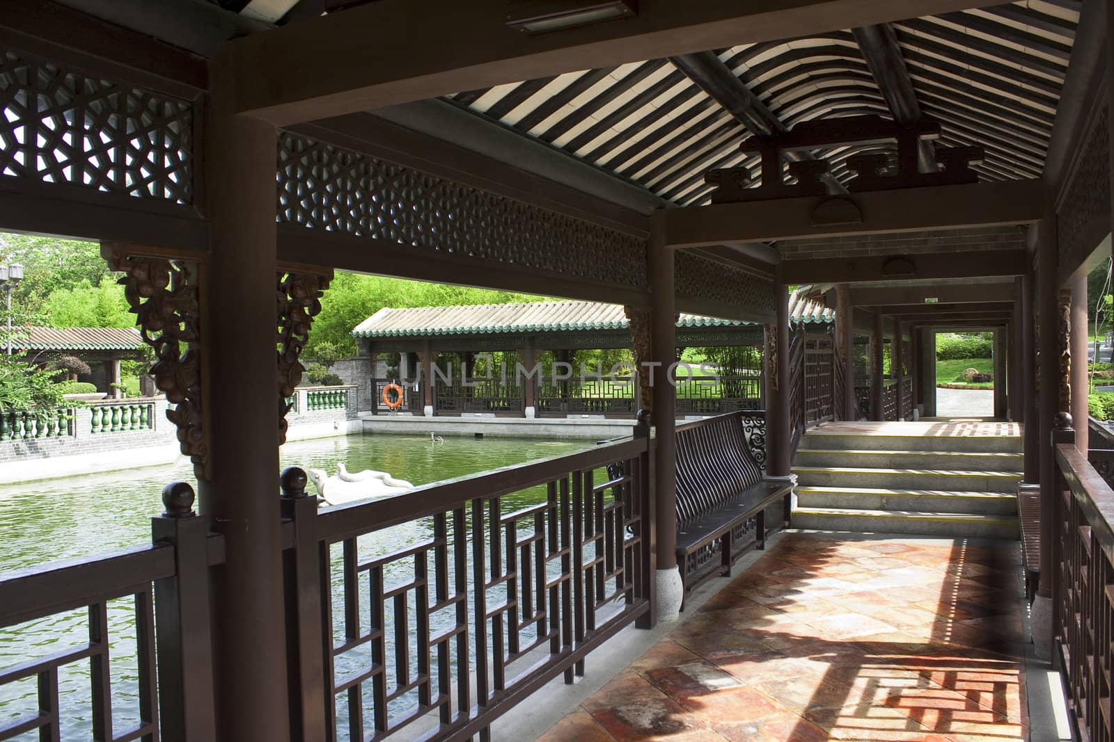 Traditional Chinese architecture, long corridor in outdoor park 