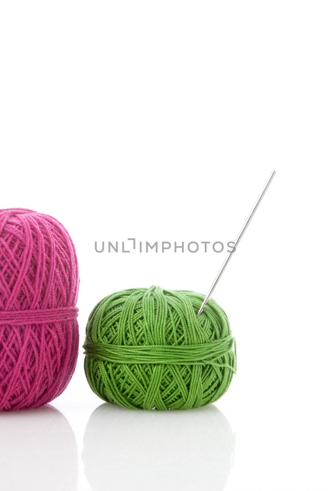 spools of many colors on a white background.