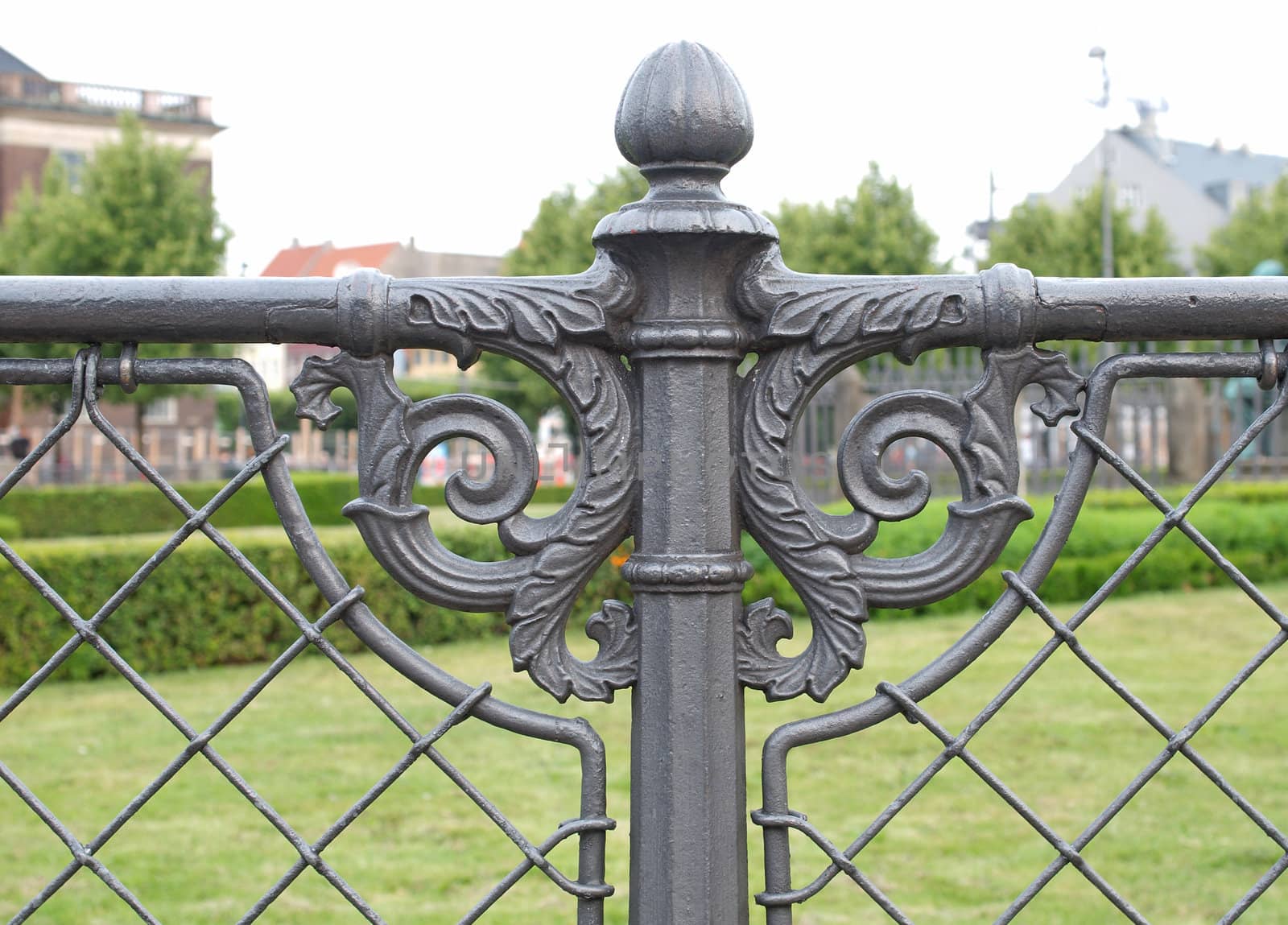artistic detail of iron fence in a park