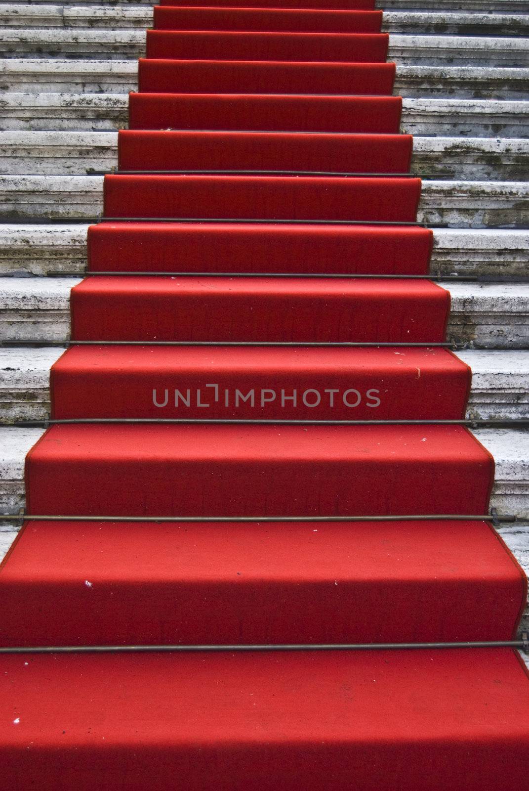 dirty red carpet leading up a staircase