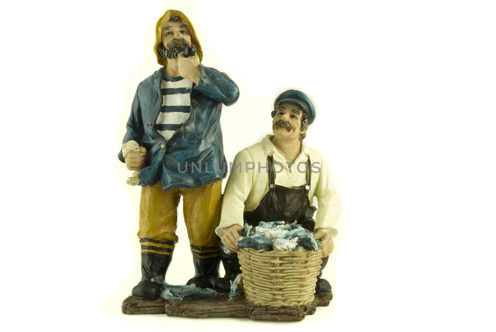 Little statue of two fishermen with their catch