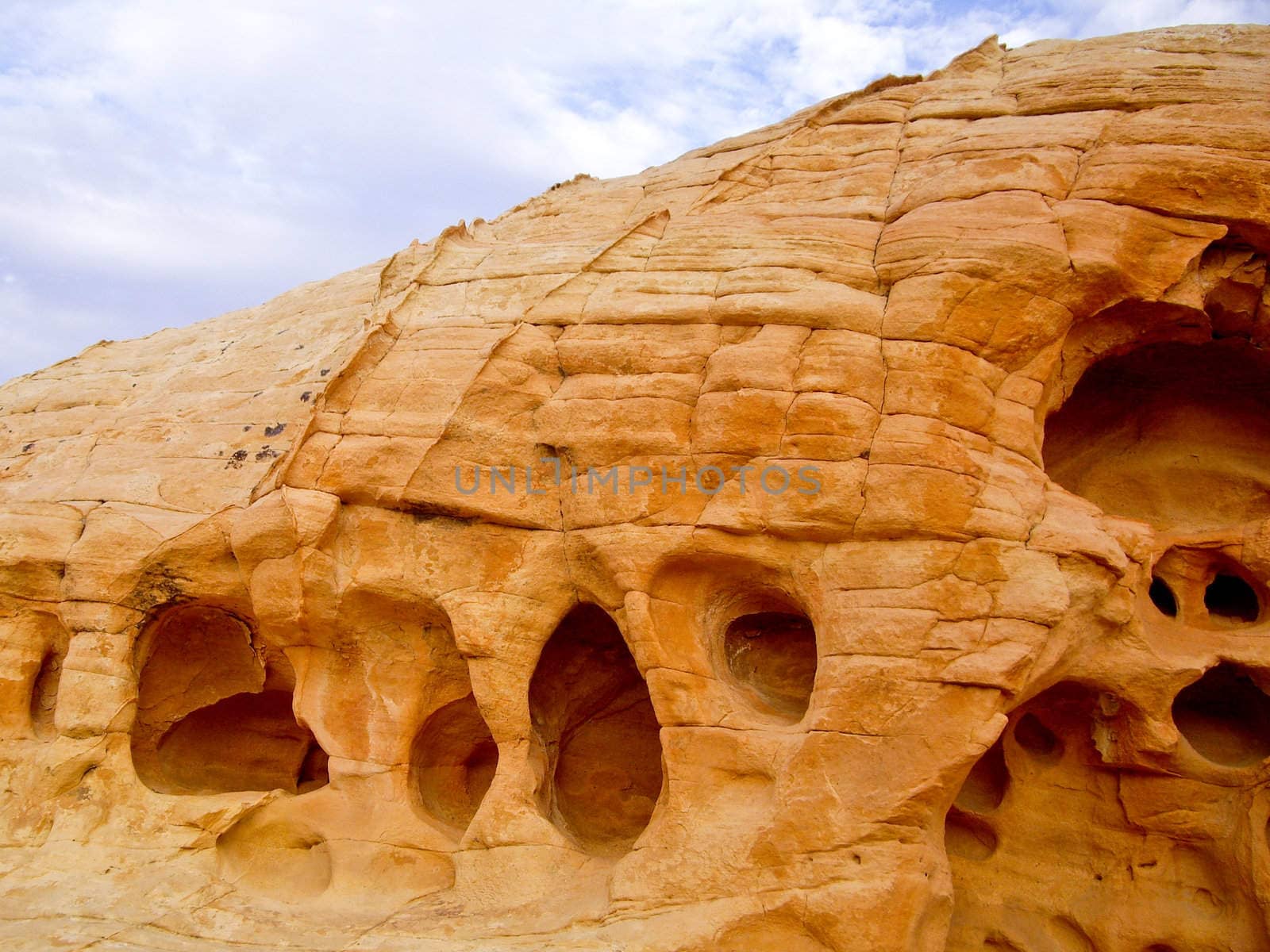Holes show powerful erosion of sandstone at Valley of Fire