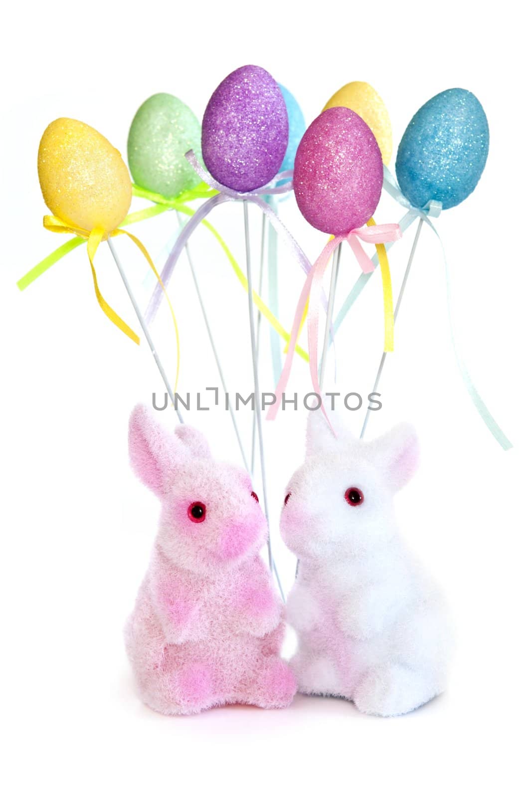 Cute Easter bunny toys and balloons isolated on white background