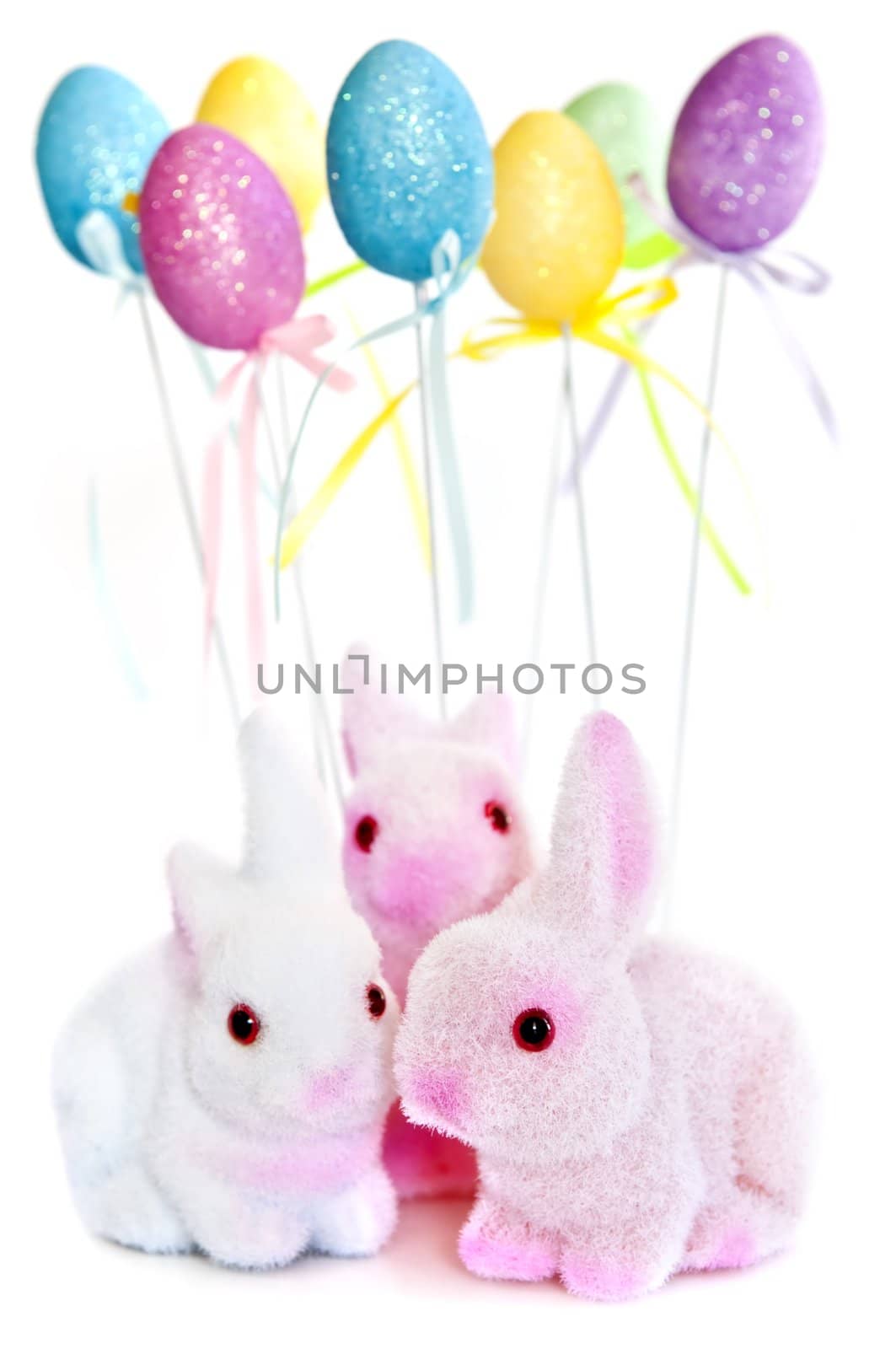 Cute Easter bunny toys and balloons isolated on white background