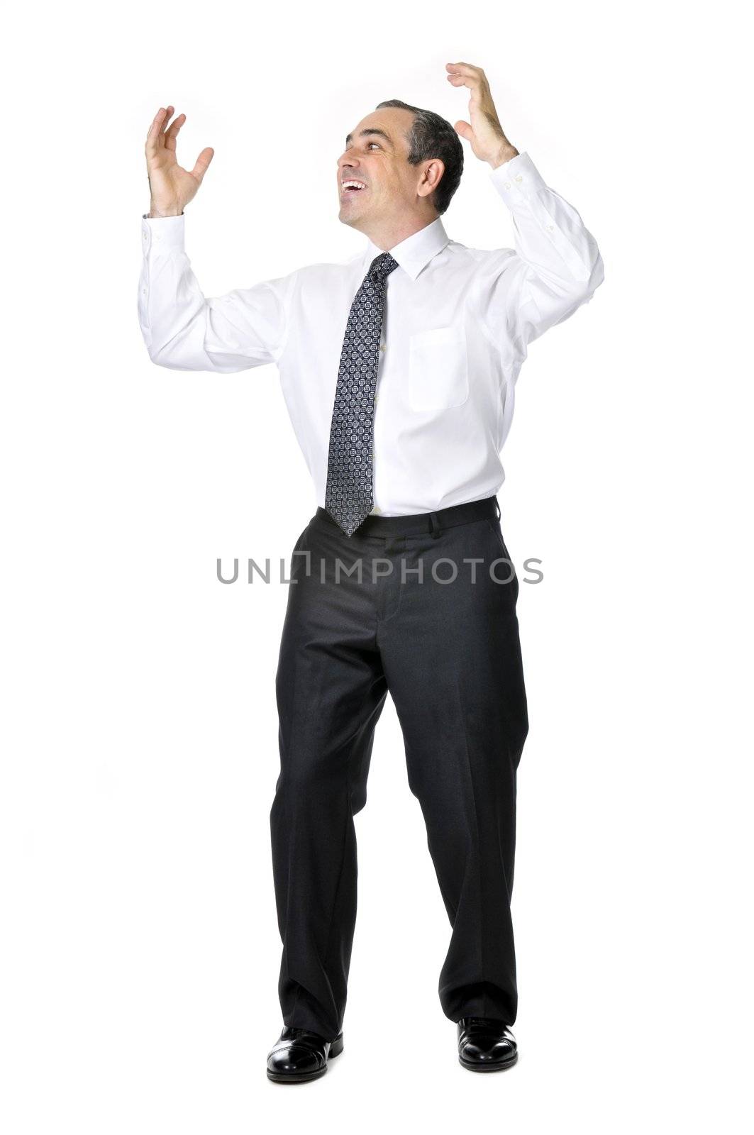 Happy celebrating business man in suit isolated on white background