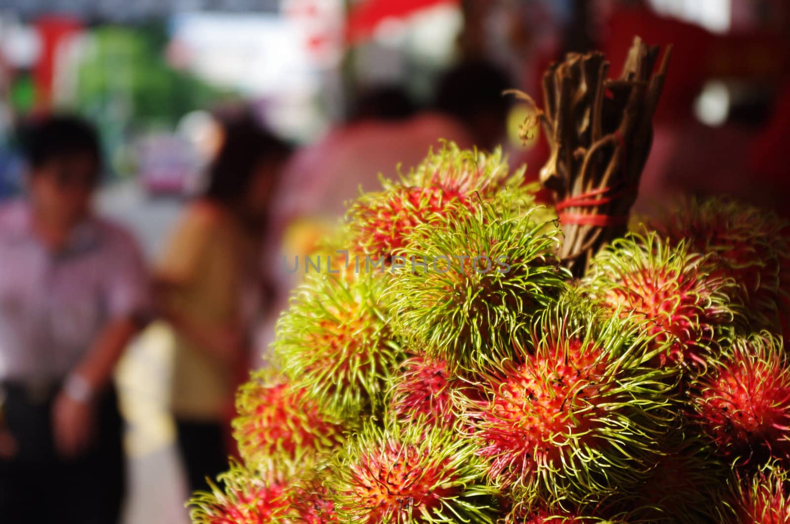 rambutans, asia exotic fruits on sale at street.