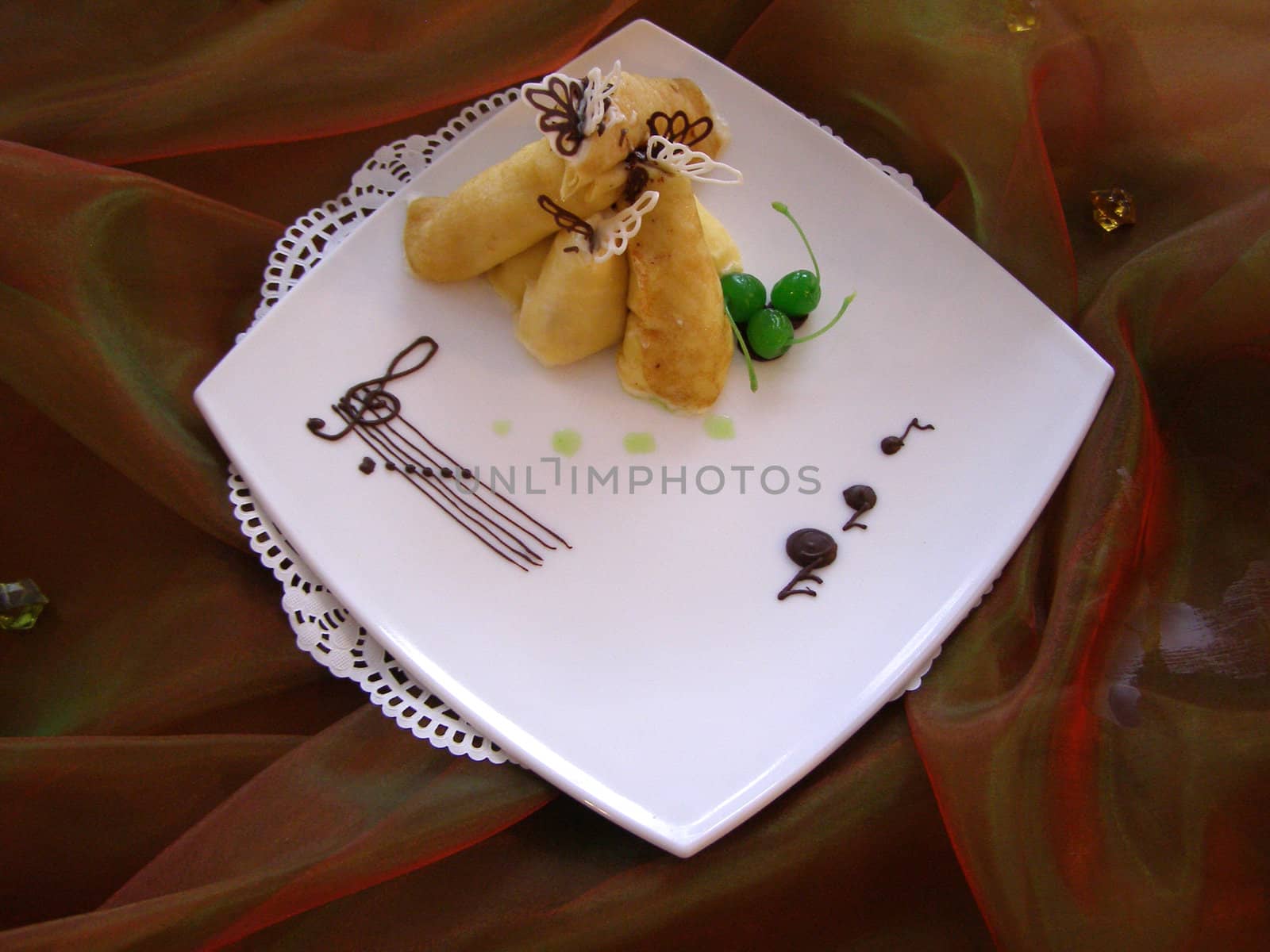 Dish with the pancakes on the tablecloth by Clarushka