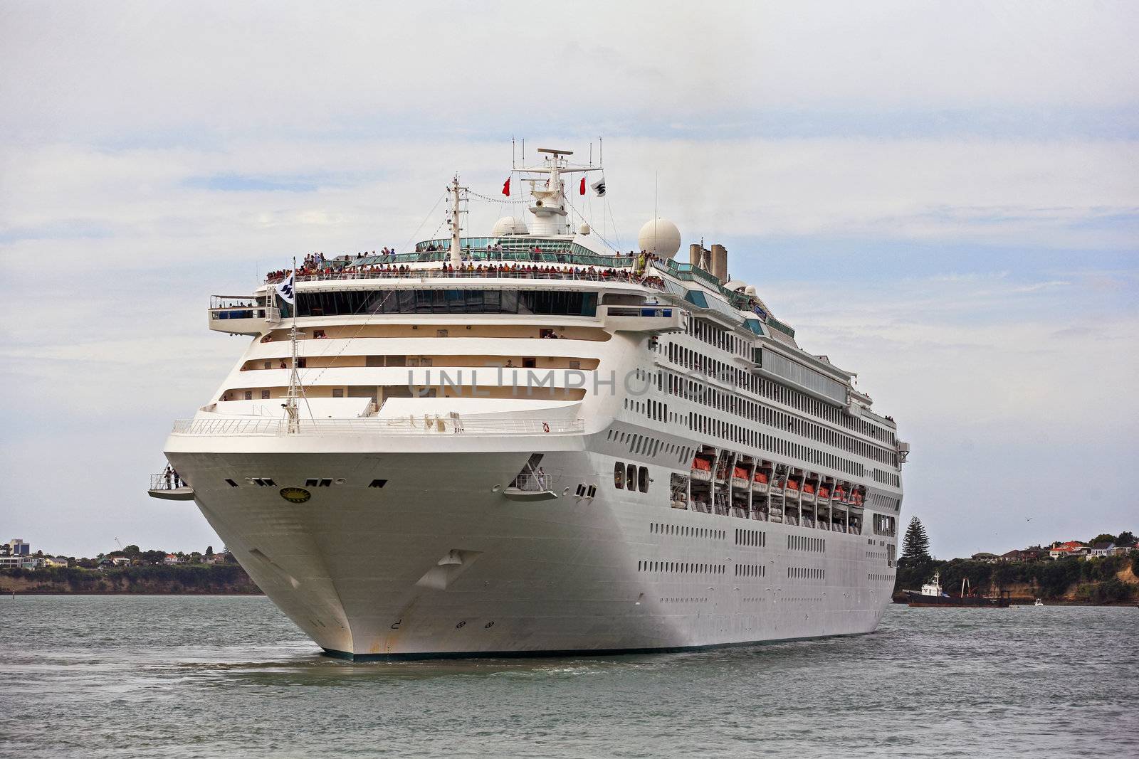 luxury white cruise ship at harbor on a sky