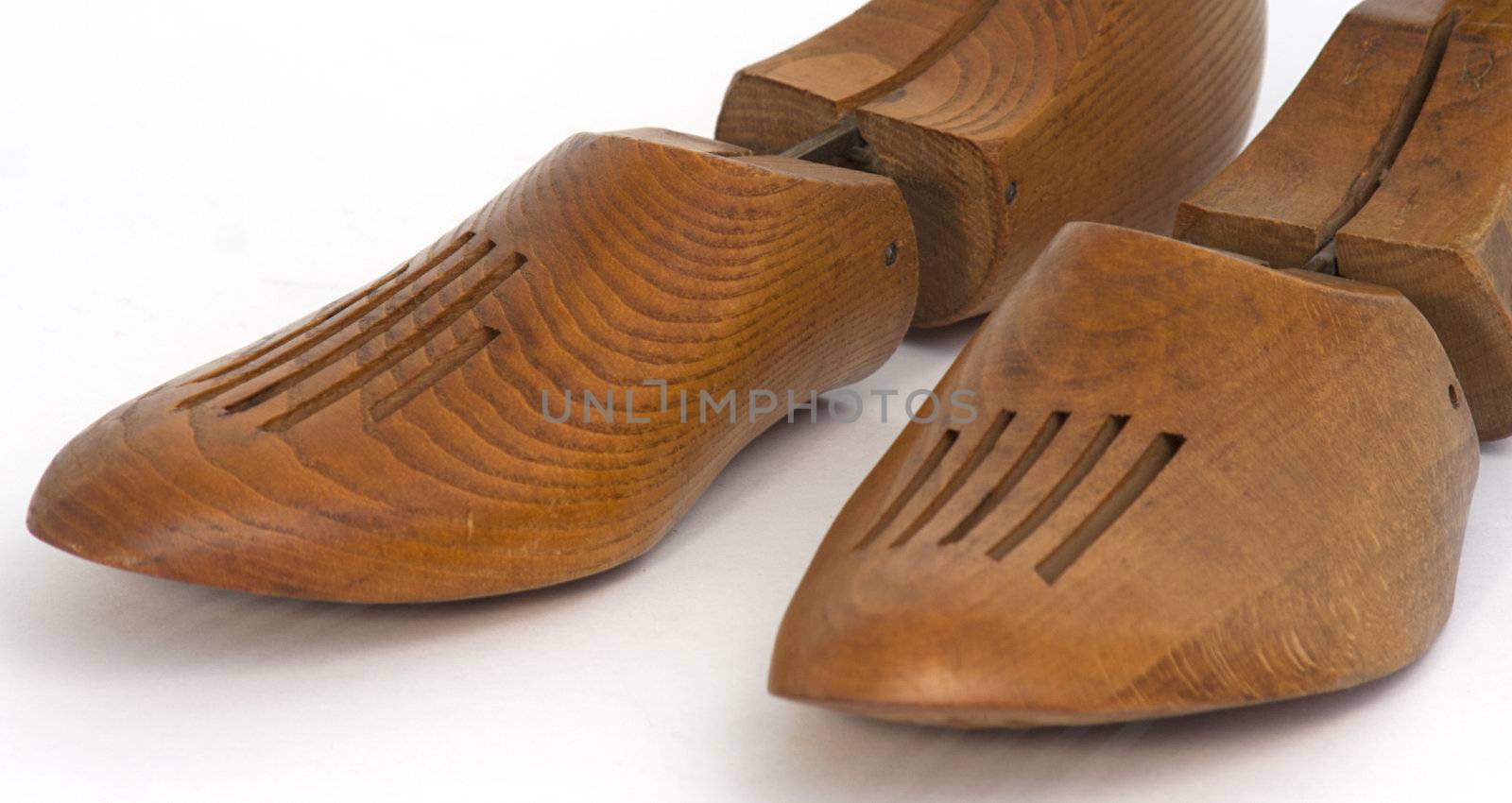 Pair of vintage wooden shoe strechers on white background - isolated - cutout with copyspace