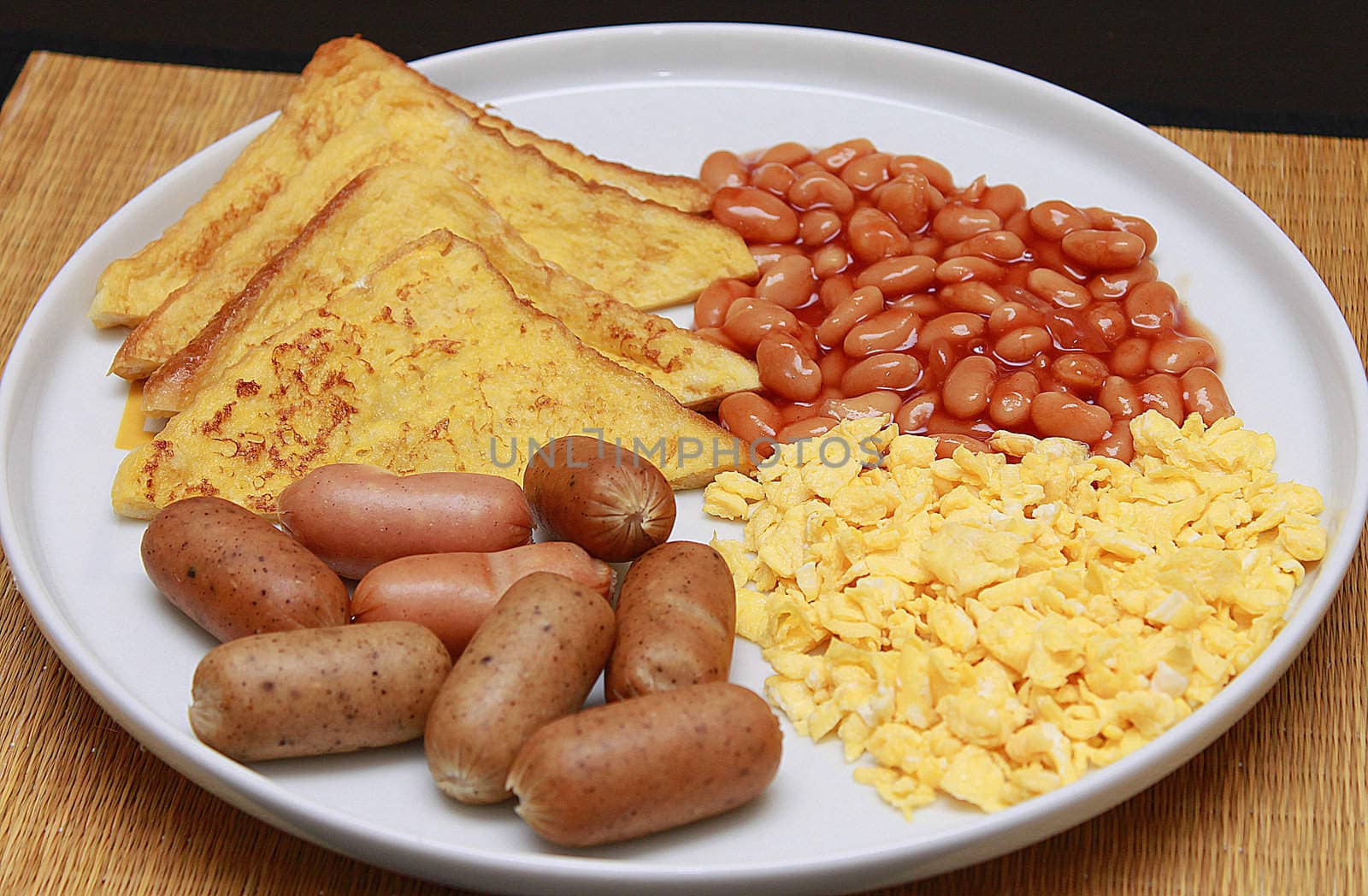 french toast, scramble egg, baked beans with sausage for breakfast