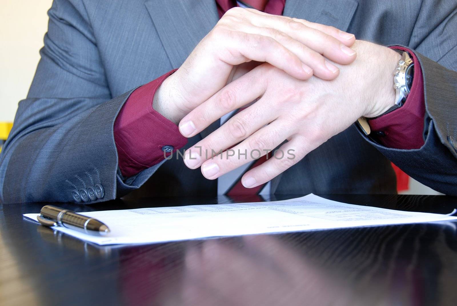 businessman hands on desk gesticulation