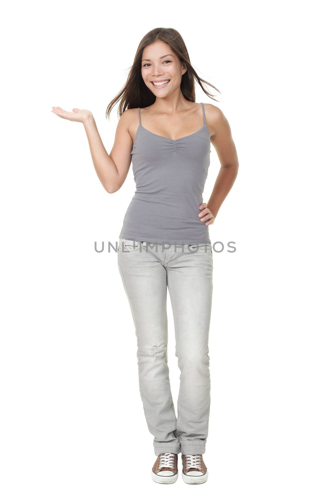 Cute female student presenting and showing copy space for product of text. Very fresh and smiling full body portrait of a beautiful mixed Chinese Asian / Caucasian young woman model standing isolated on white background.