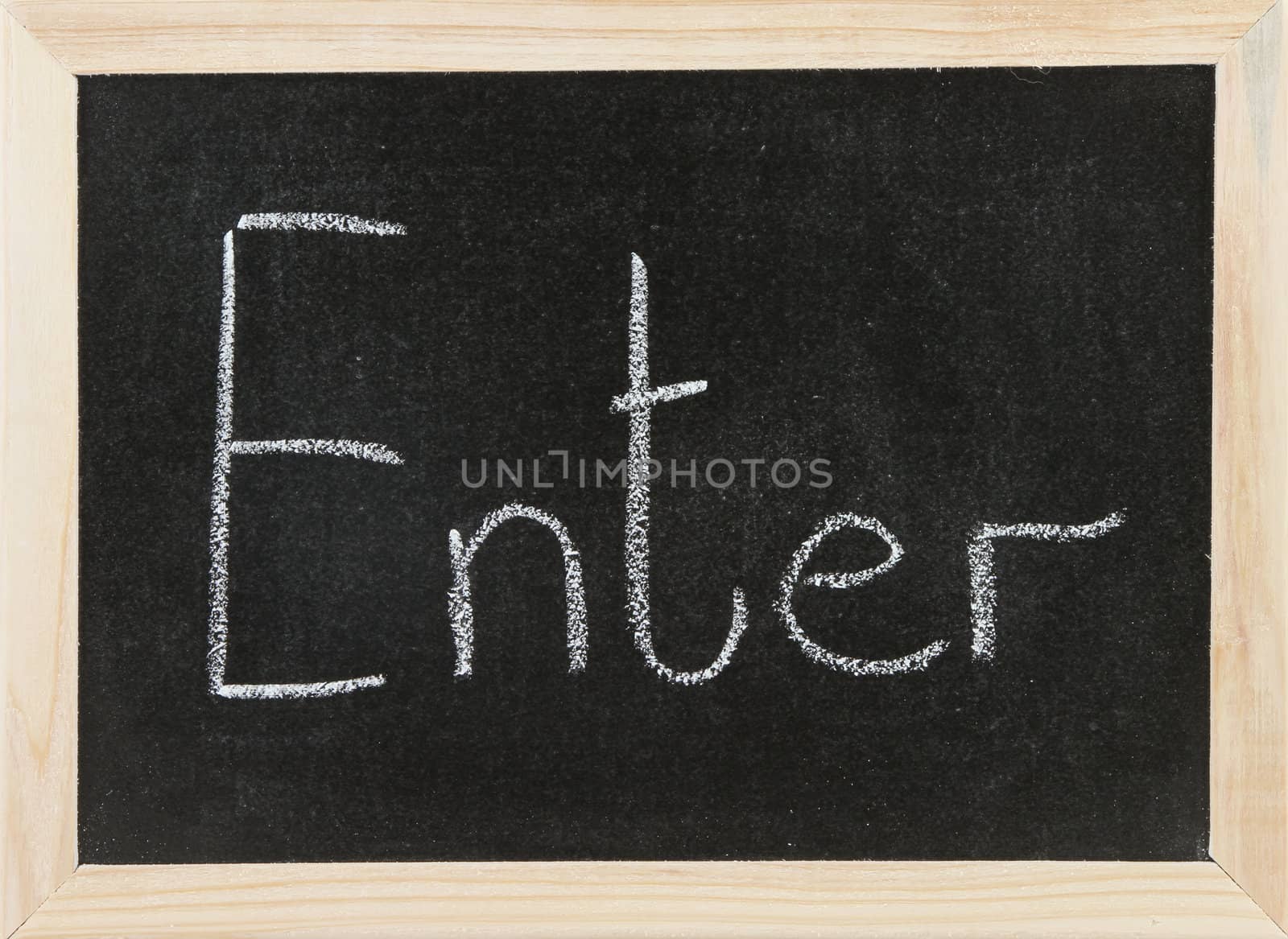 Black chalk board with wooden framed surround with the word Enter.