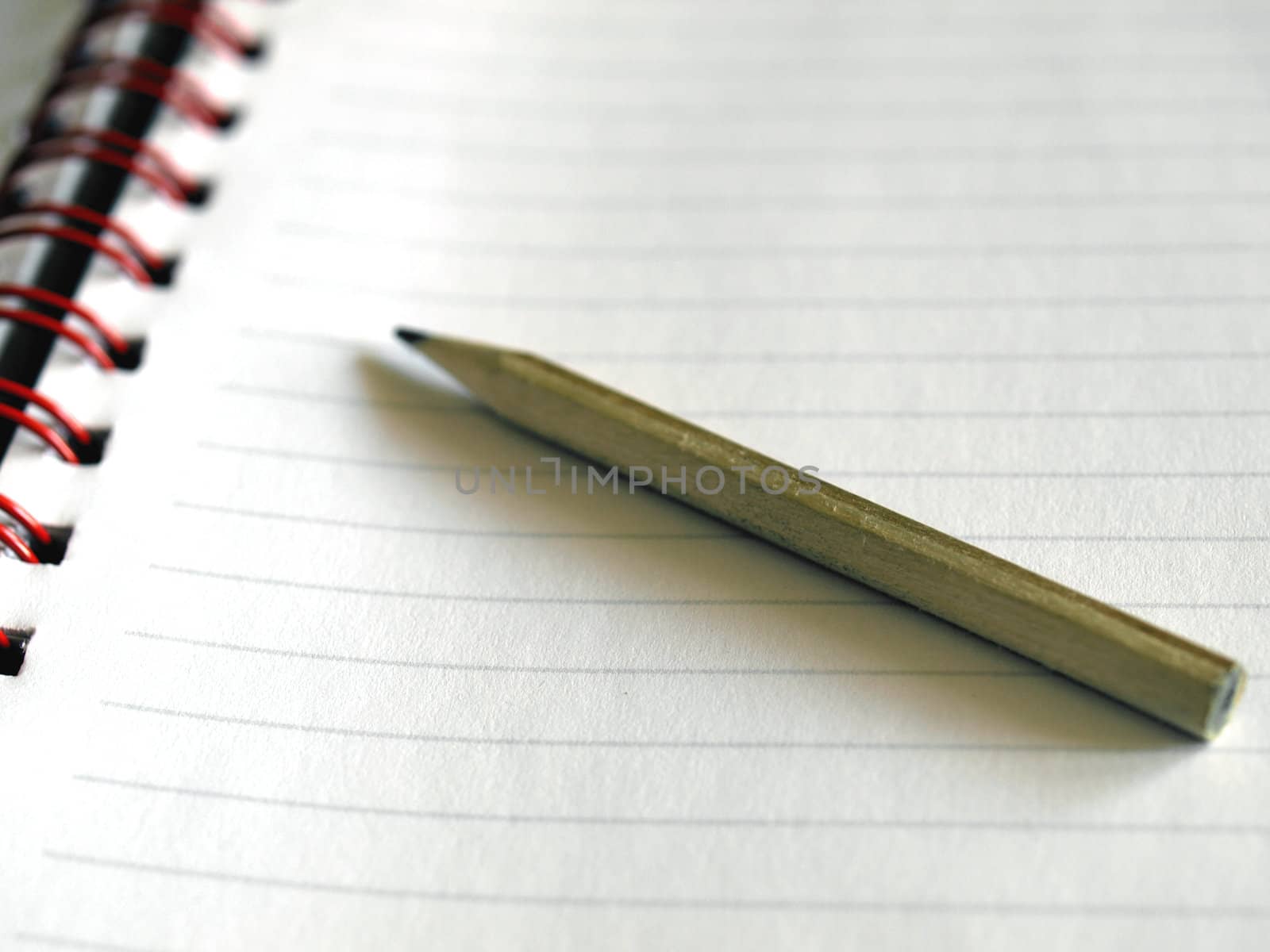 Notebook note pad page with pencil