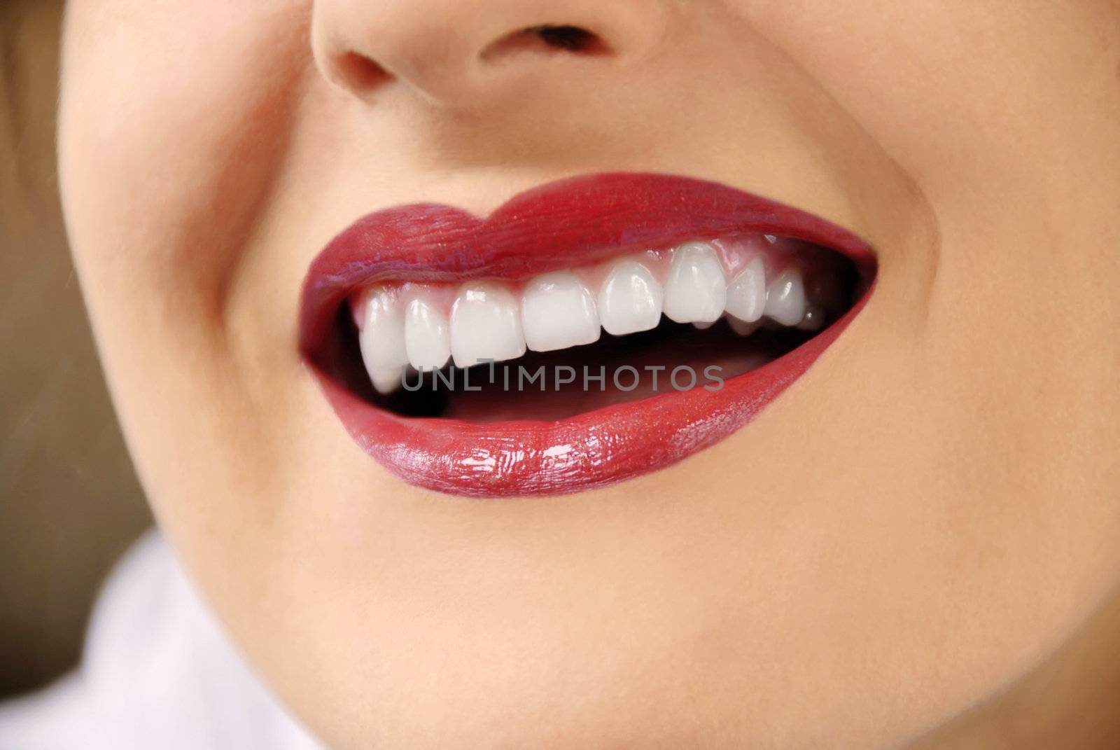 woman with white teeth and red lips laughing