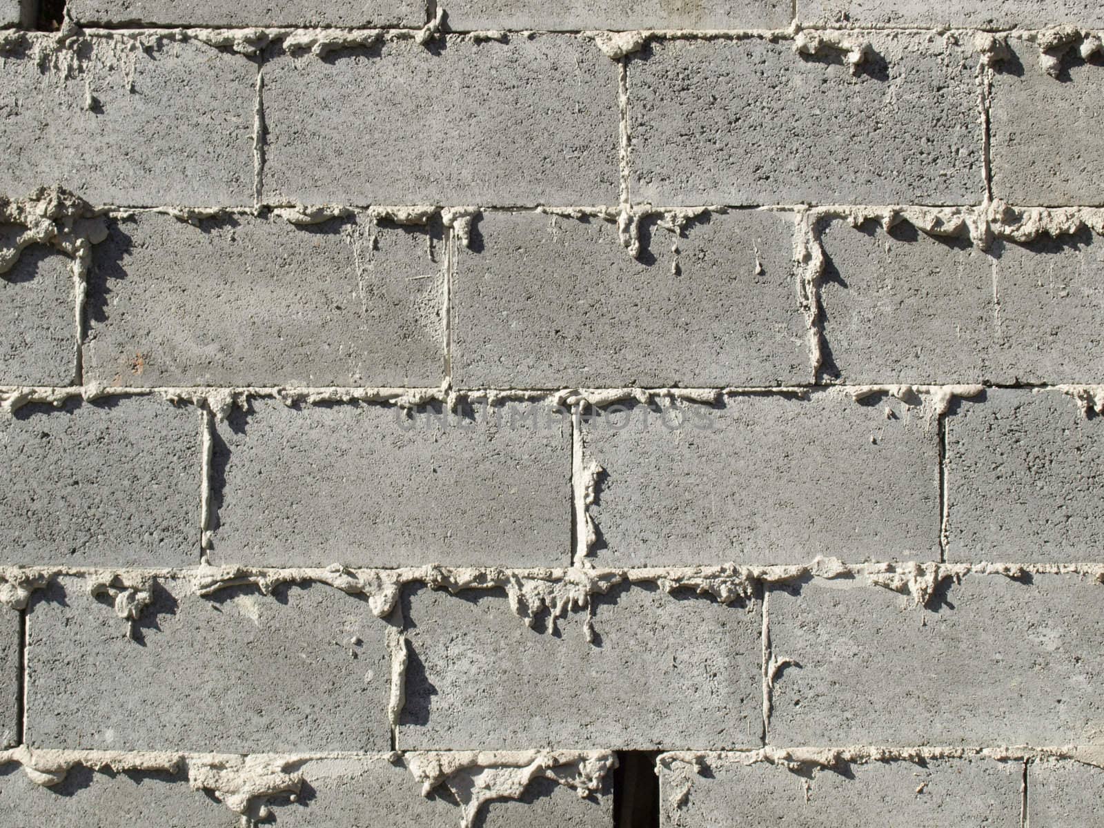 Old and grunge wall of concrete bricks