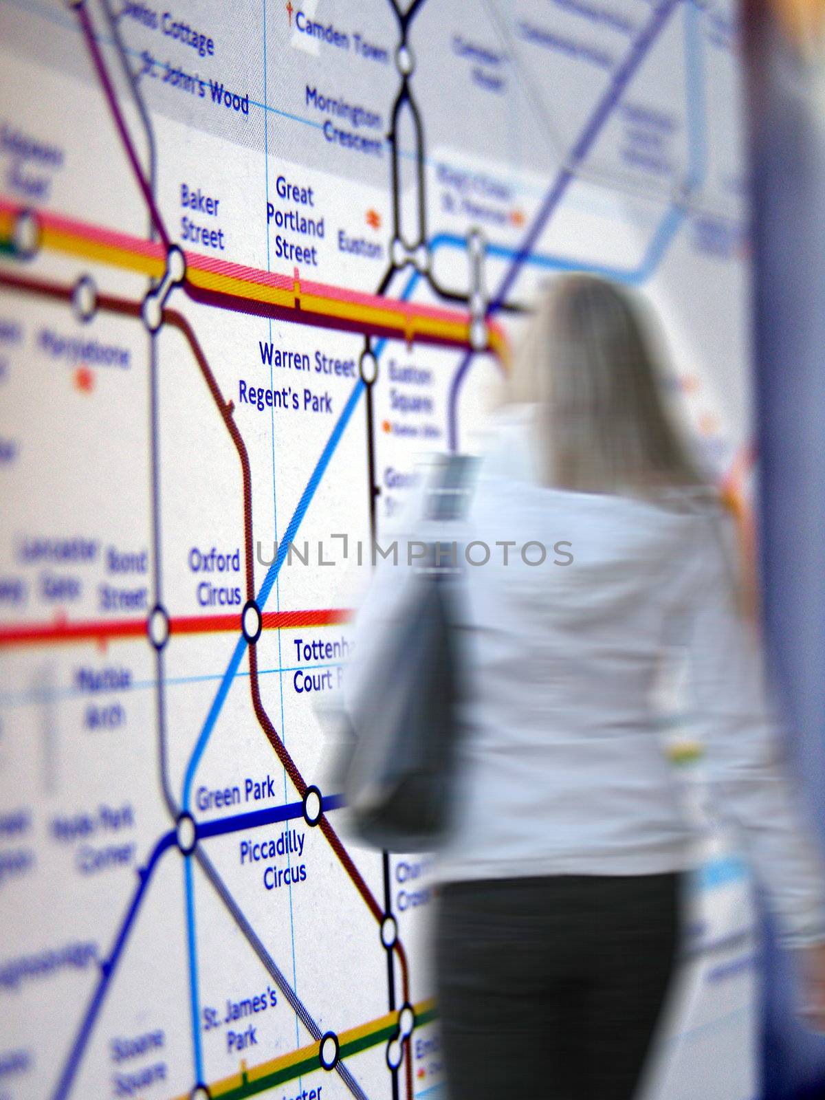 Girl wallking in the London Tube underground