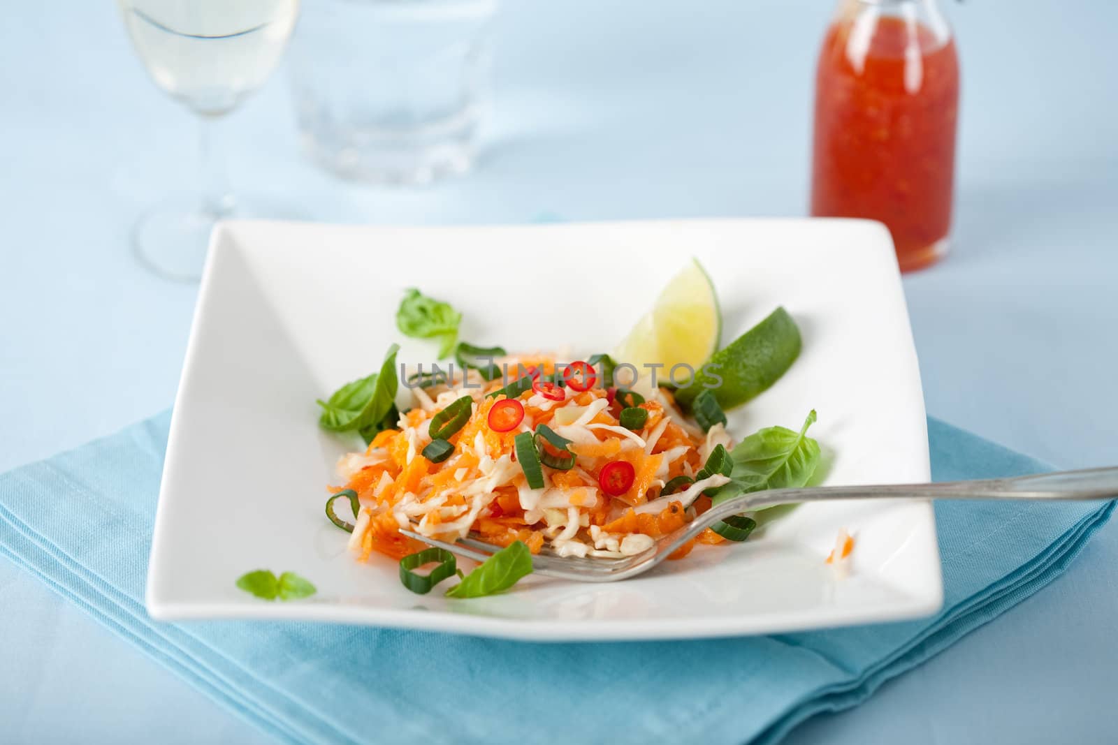 Delicious carrot salad with cabbage, lime, chile and spring onions
