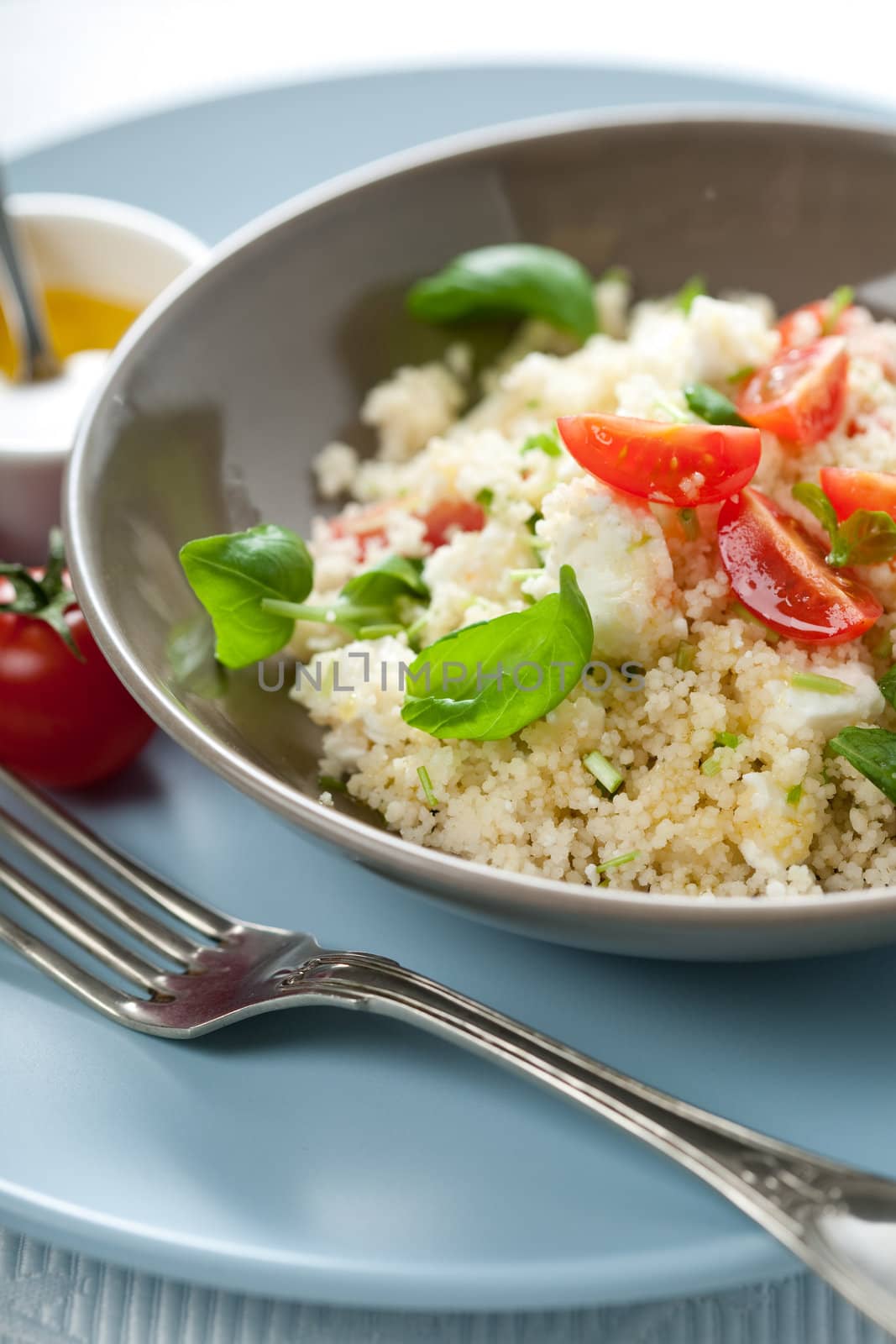 Delicious dish with fresh couscous salad and cherry tomatoes