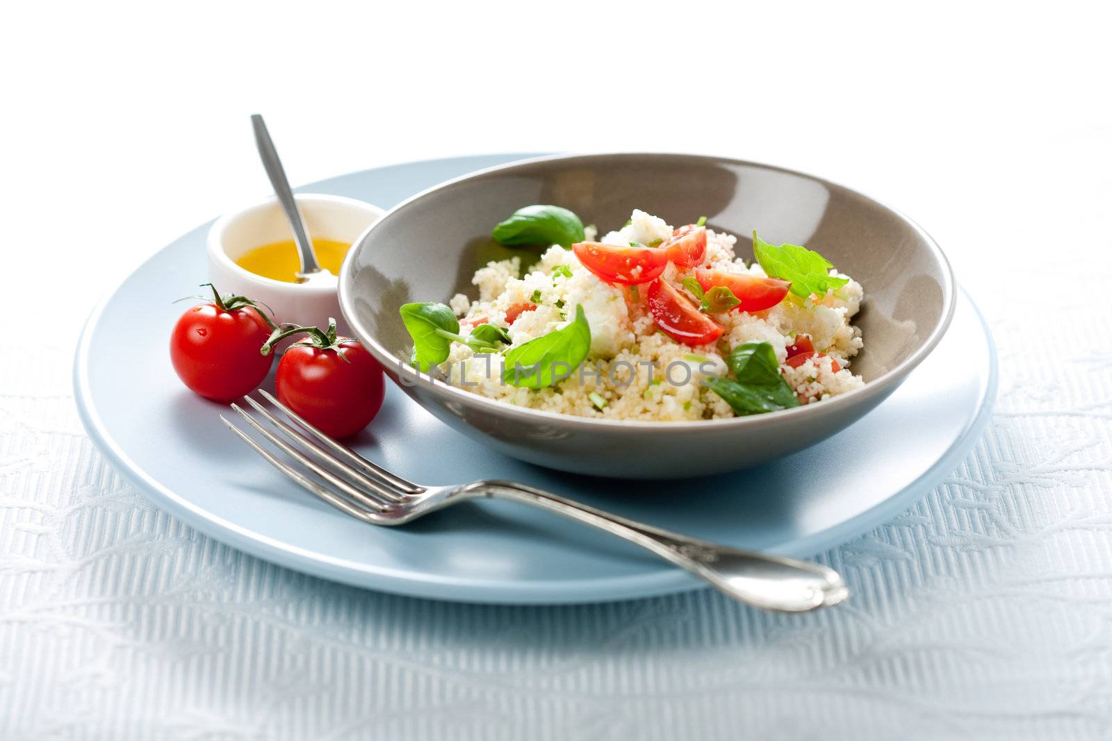 Delicious fresh couscous salad with feta and basil