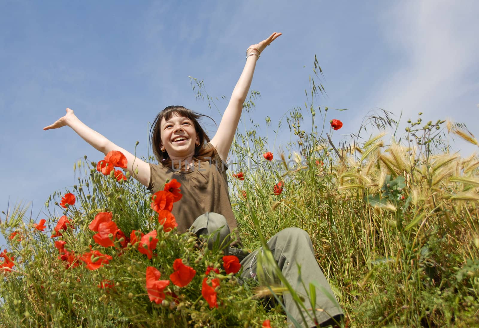 smiling girl in field by cynoclub