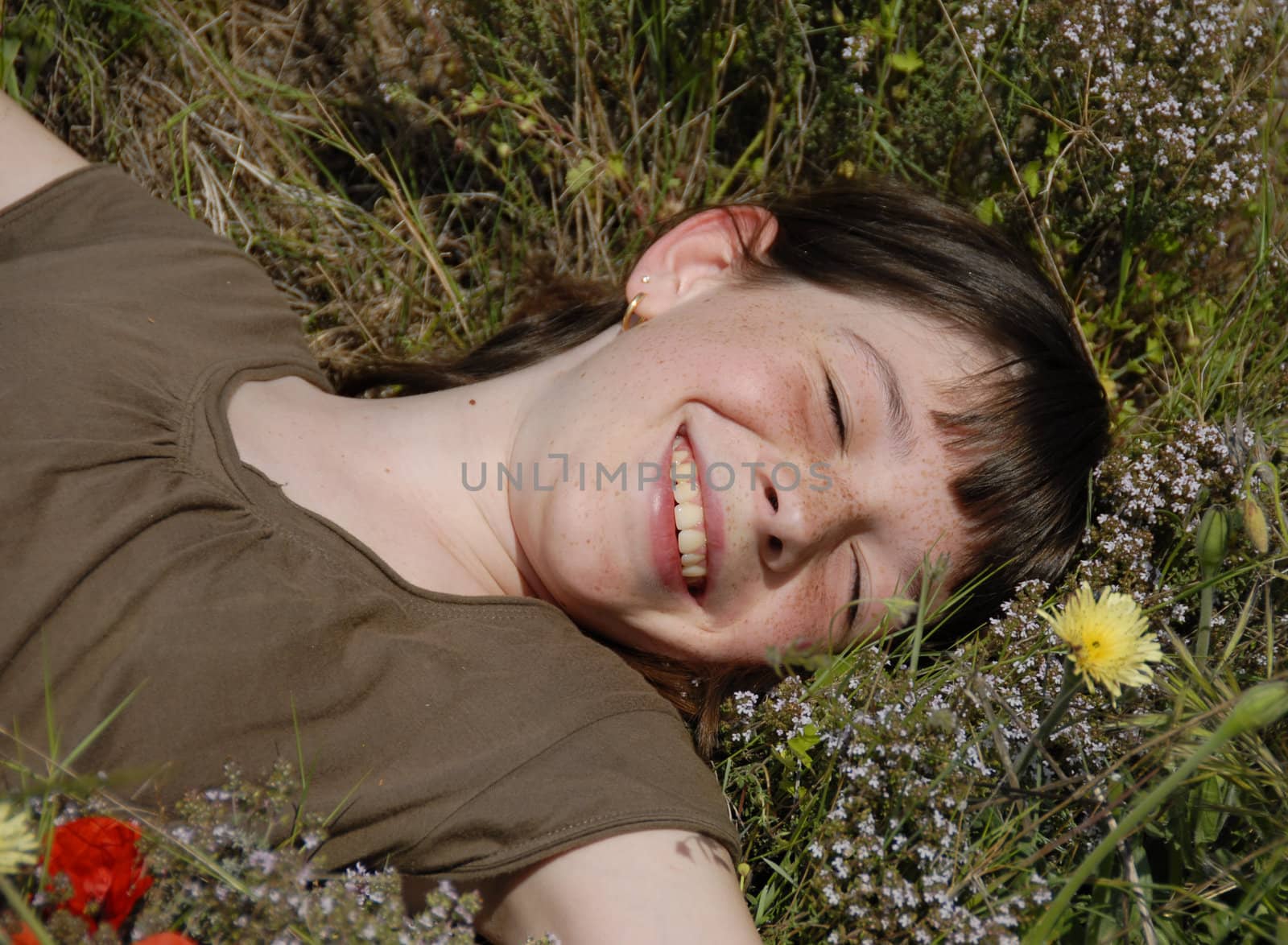 smiling girl in field by cynoclub