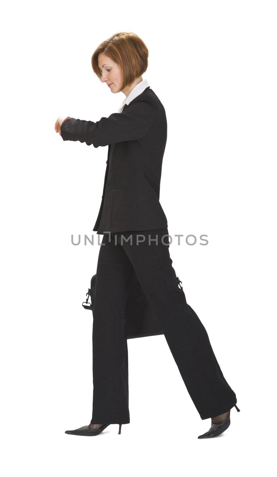 Businesswoman walking and checking the time. 
